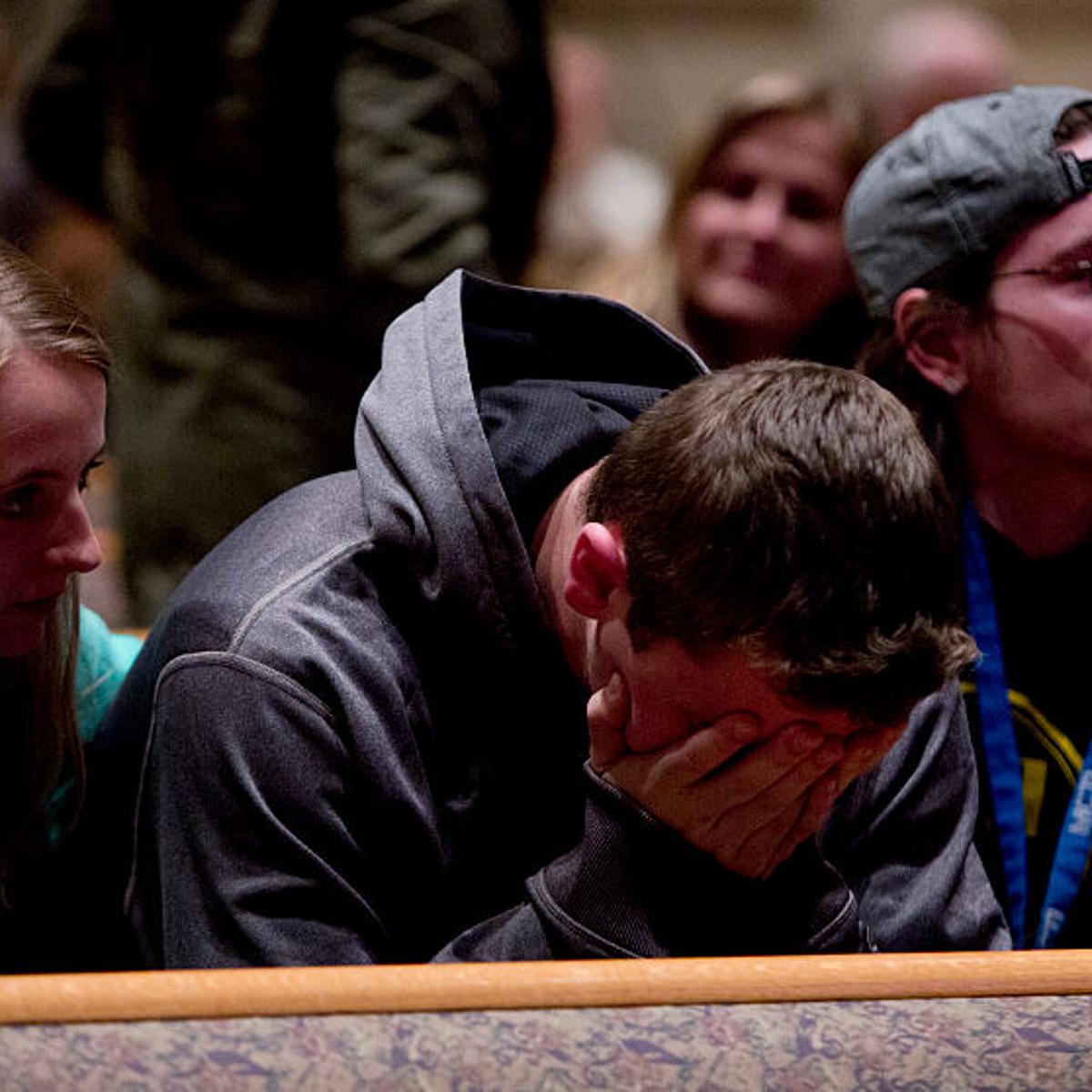 People gather and pray at Center Point Church following a mass shooting on February 21, 2016 in Kalamazoo, Michigan.