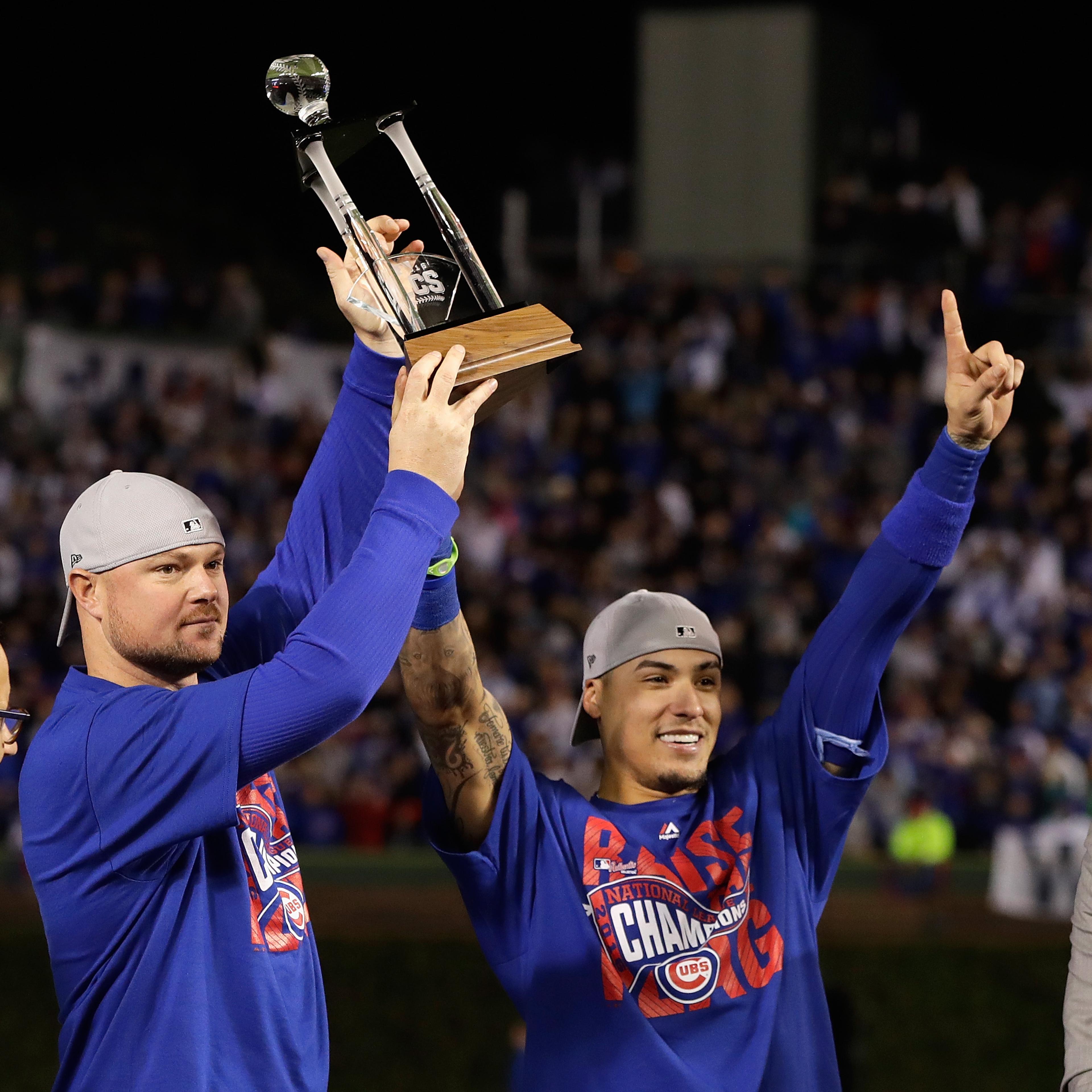 The co-MVPs of the NLCS, Jon Lester (left) and Javier Baez of the Chicago Cubs, pose after Chicago defeated the Los Angeles Dodgers 5-0 in game six of the NLCS Series to advance to the World Series.