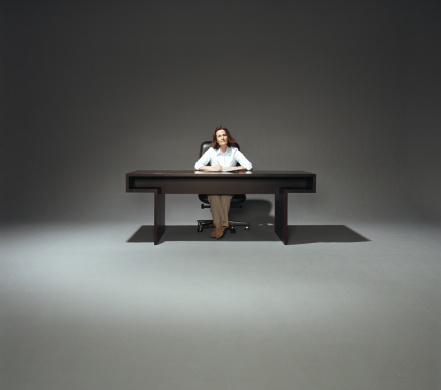 businesswoman-sitting-desk