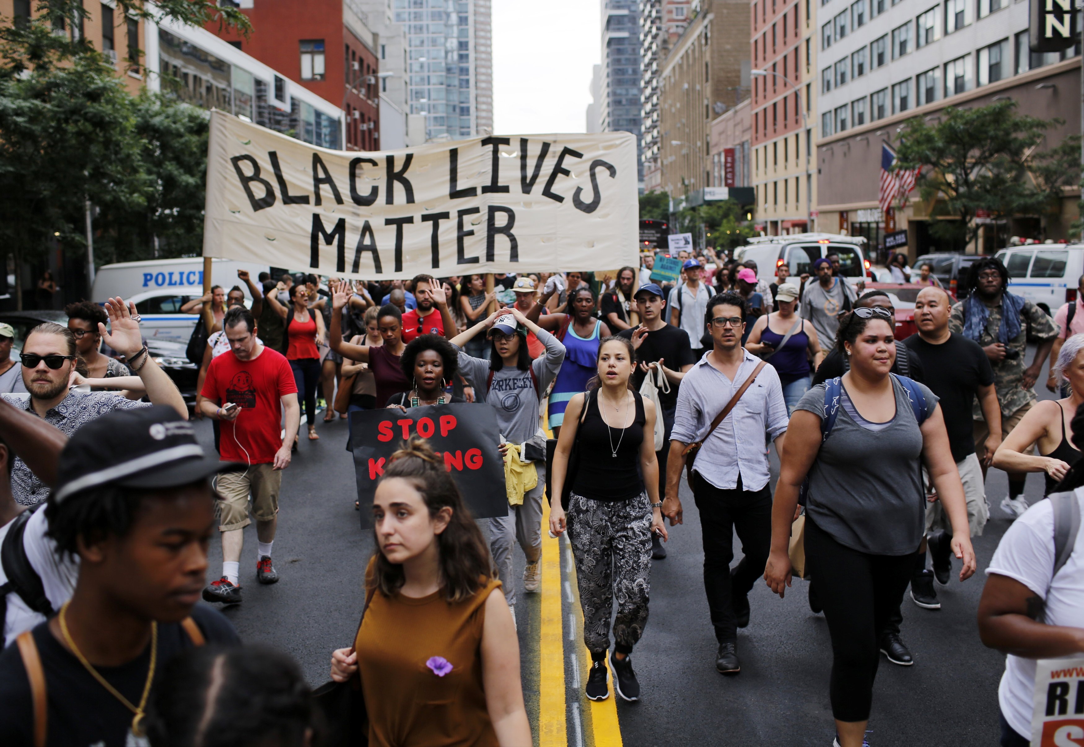 People take part in a protest for the killing of Alton Sterling and Philando Castile during a march along Manhattan's streets in New York