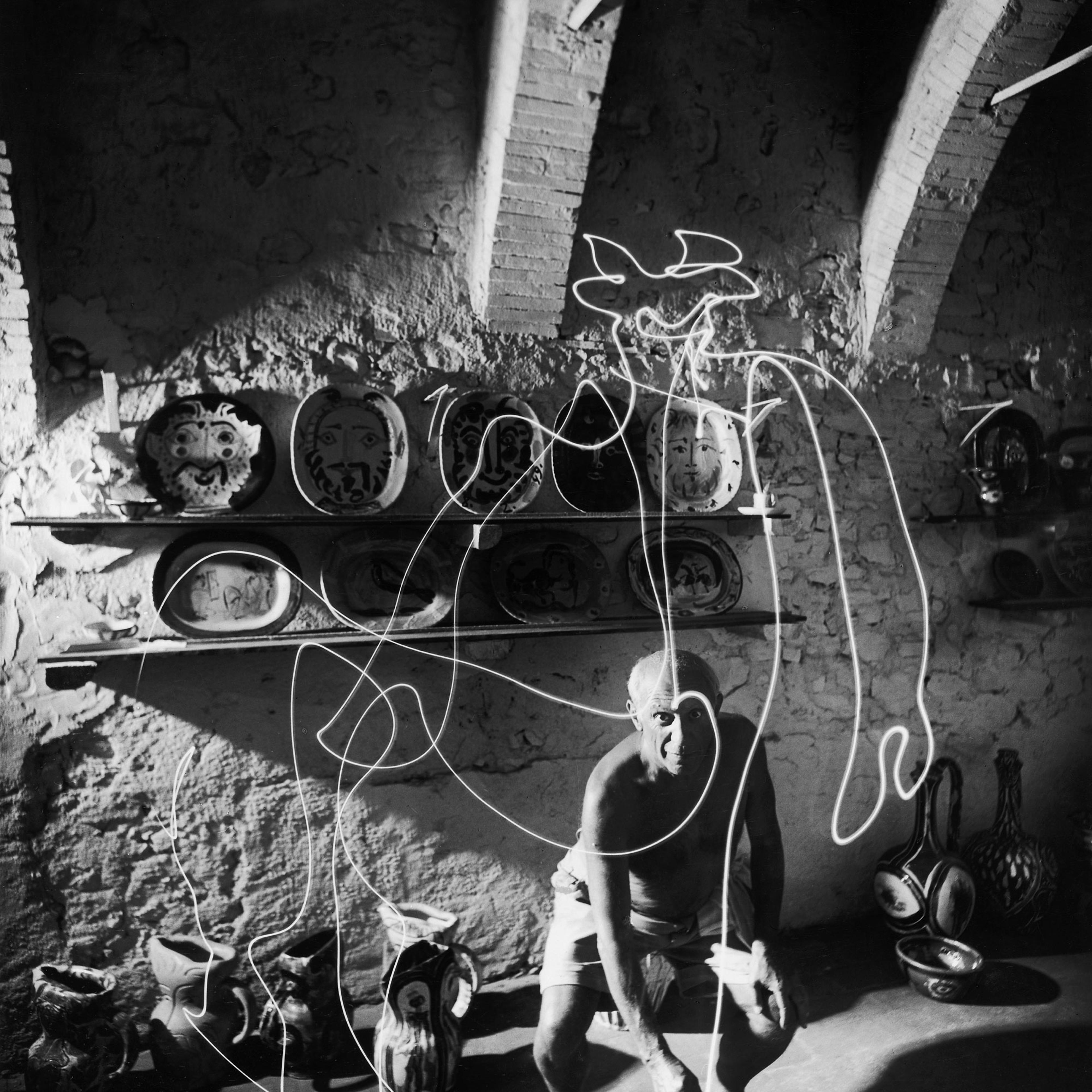 Pablo Picasso "draws" a centaur in the air with light, 1949.