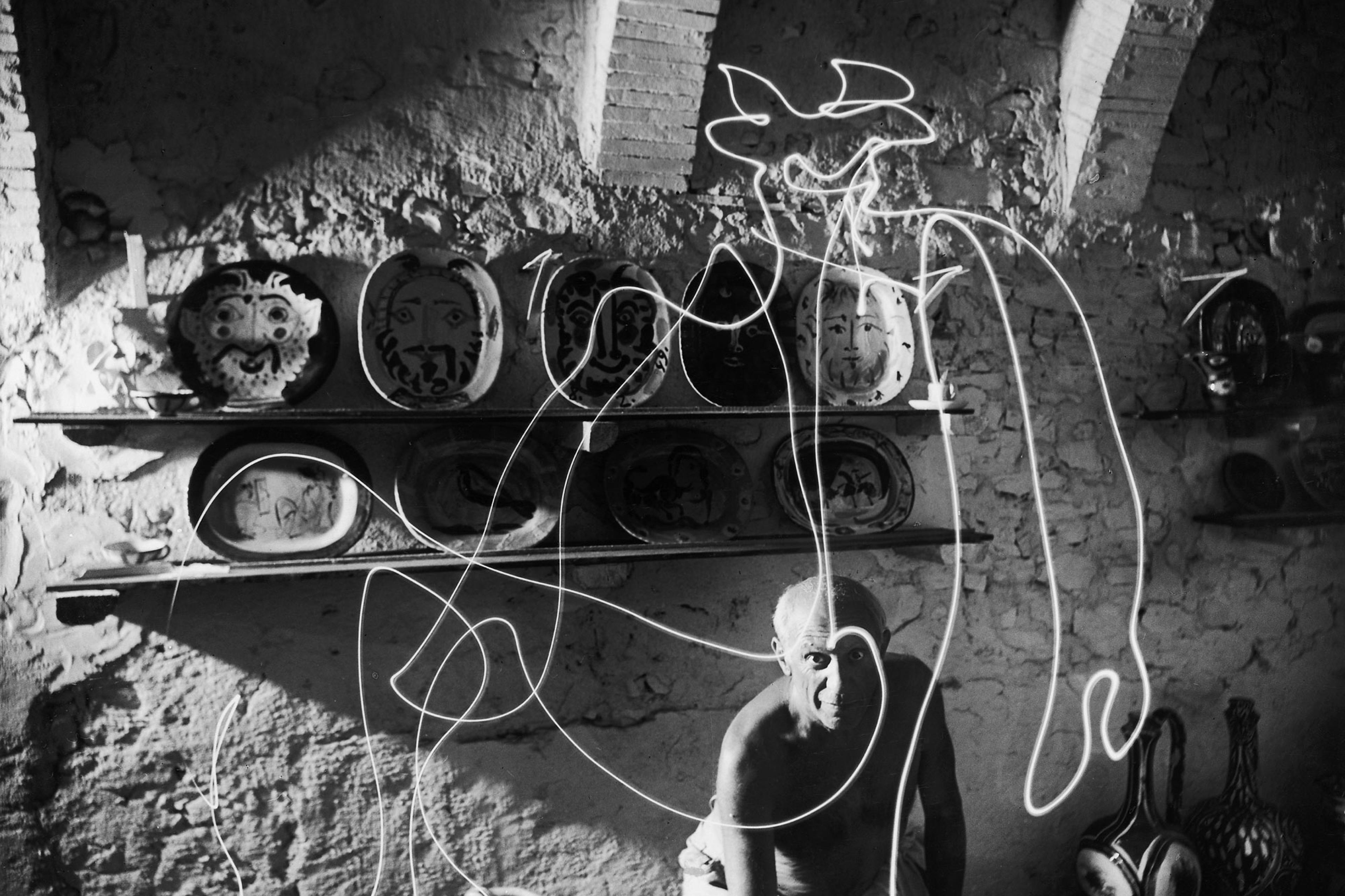 Pablo Picasso "draws" a centaur in the air with light, 1949.