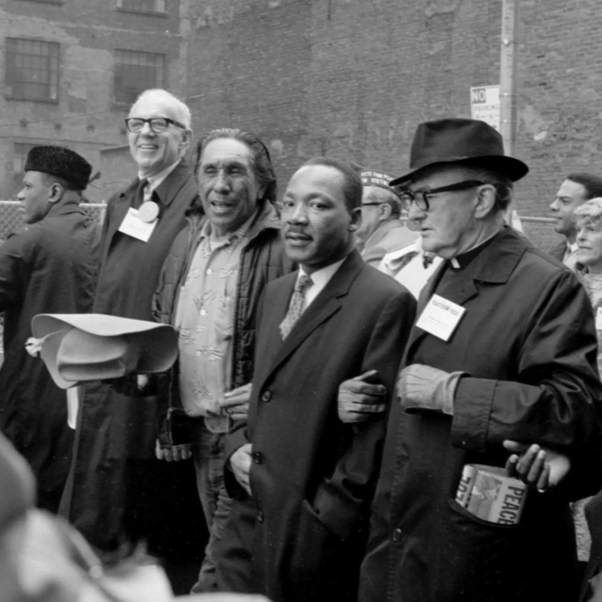 Martin Luther King Jr. marching in Vietnam protest parade.