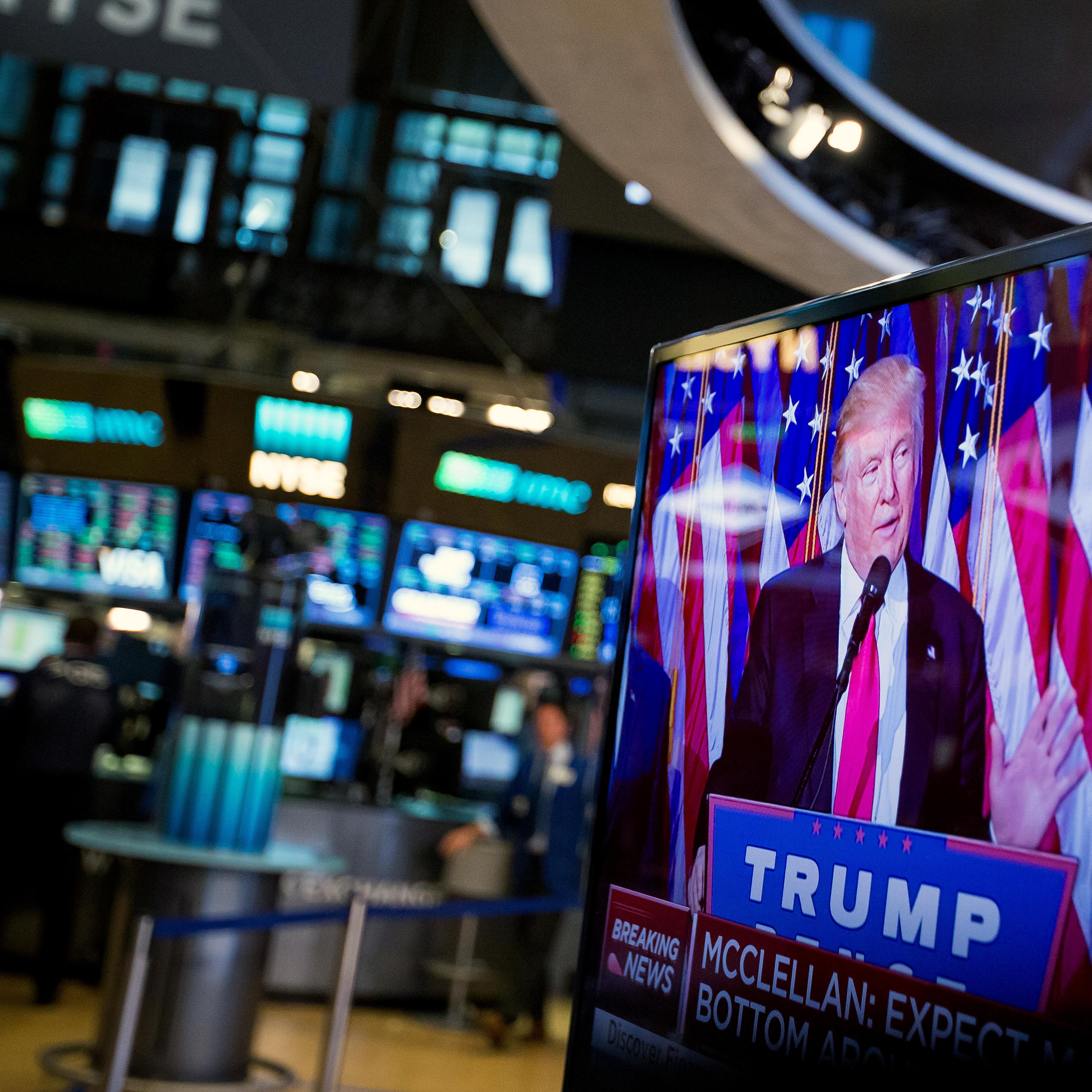 U.S. President-elect Donald Trump is seen speaking on a television on the floor of the New York Stock Exchange (NYSE) in New York, U.S., on Wednesday, Nov. 9, 2016.