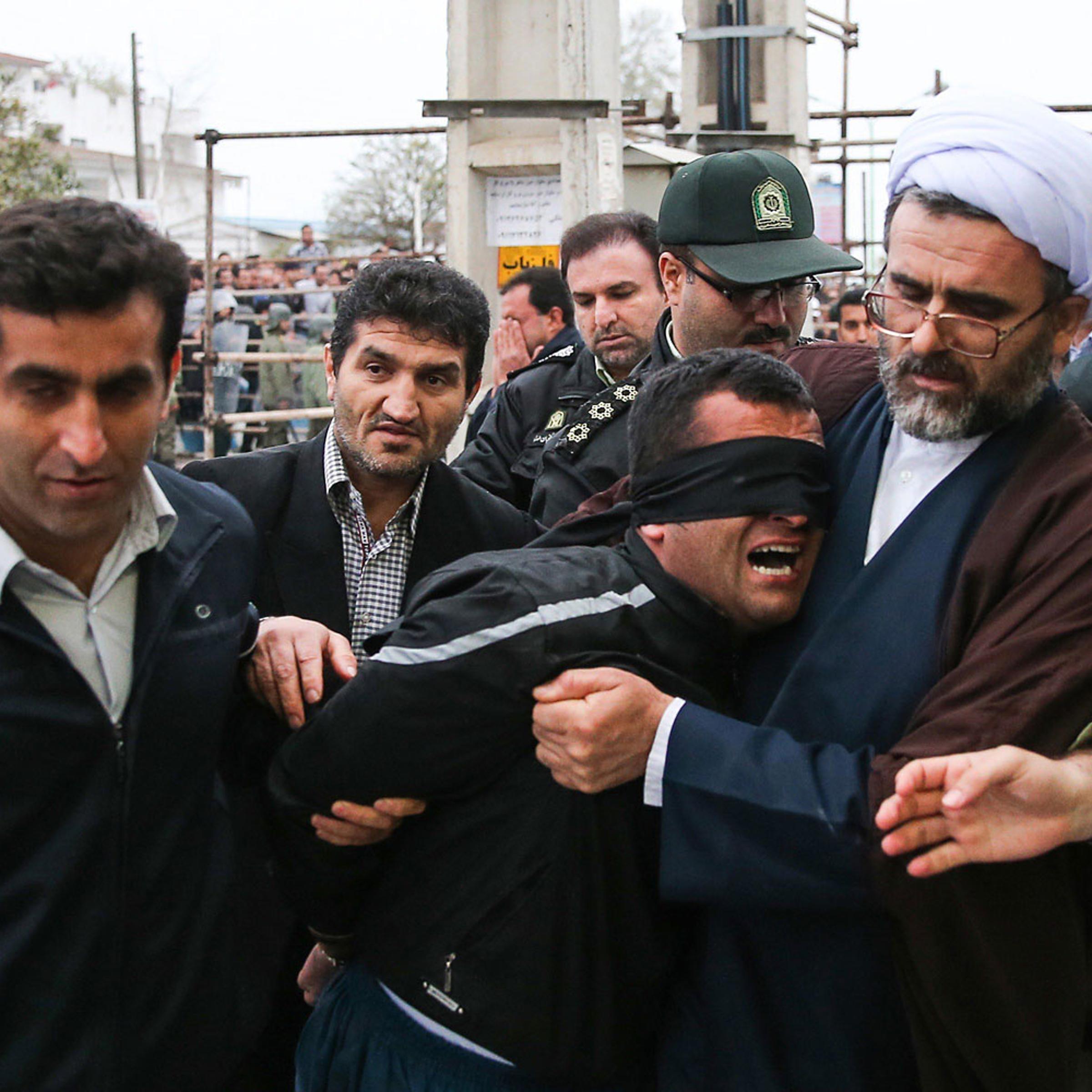 Balal, who killed an Iranian youth Abdolah Hosseinzadeh in a street fight with a knife in 2007, is brought to the gallows during his execution ceremony in the northern city of Nowshahr on April 15, 2014.