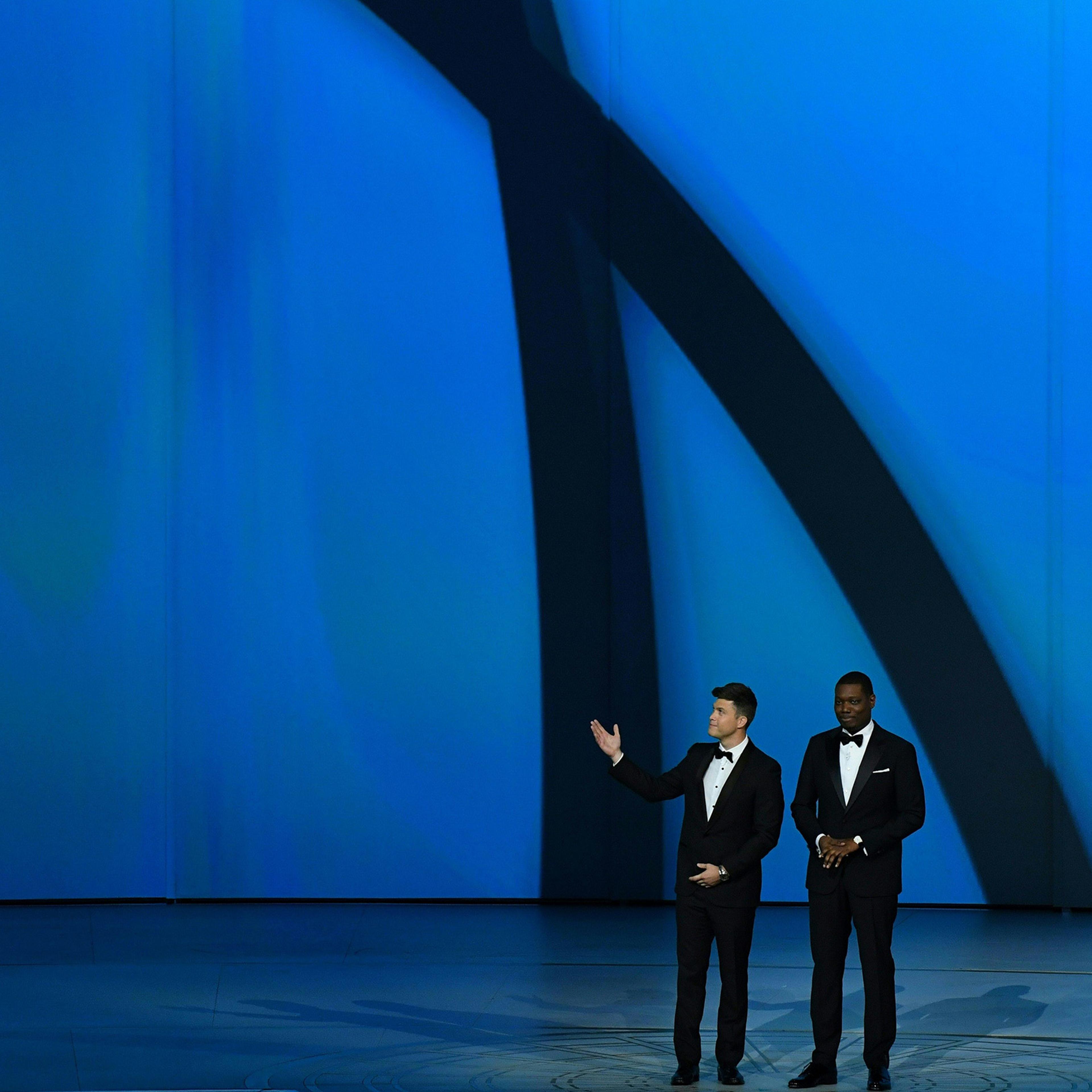 Host Colin Jost and Michael Che speak onstage during the 70th Emmy Awards at the Microsoft Theatre in Los Angeles on Sept. 17, 2018.