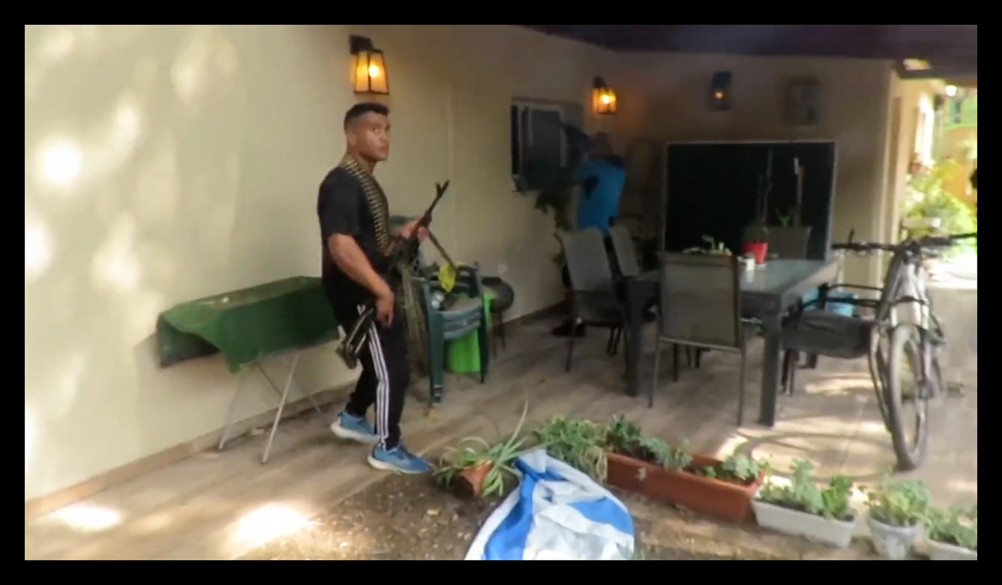 A video still from recovered Hamas body camera footage shows their infiltration into southern Israel from Gaza on Oct 7, 2023.