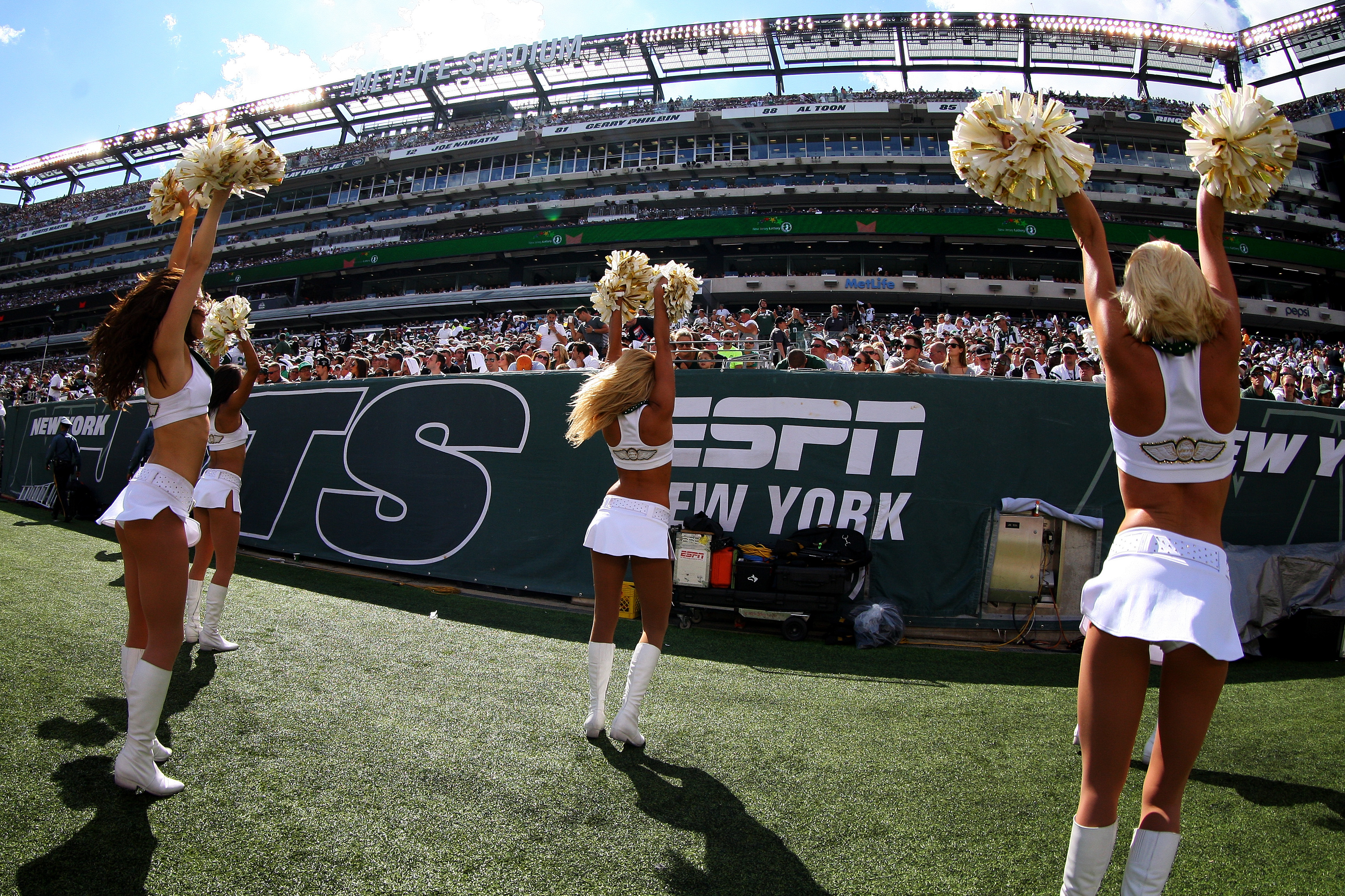 The New York Jets Flight Crew cheerleaders perform during the fourth quarter of a game between the New York Jets and the Oakland Raiders at MetLife Stadium on Sept. 7, 2014 in East Rutherford, New Jersey.
