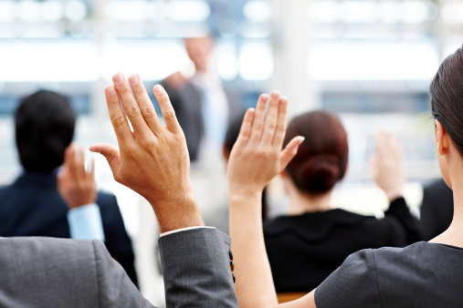 business-people-raising-hands