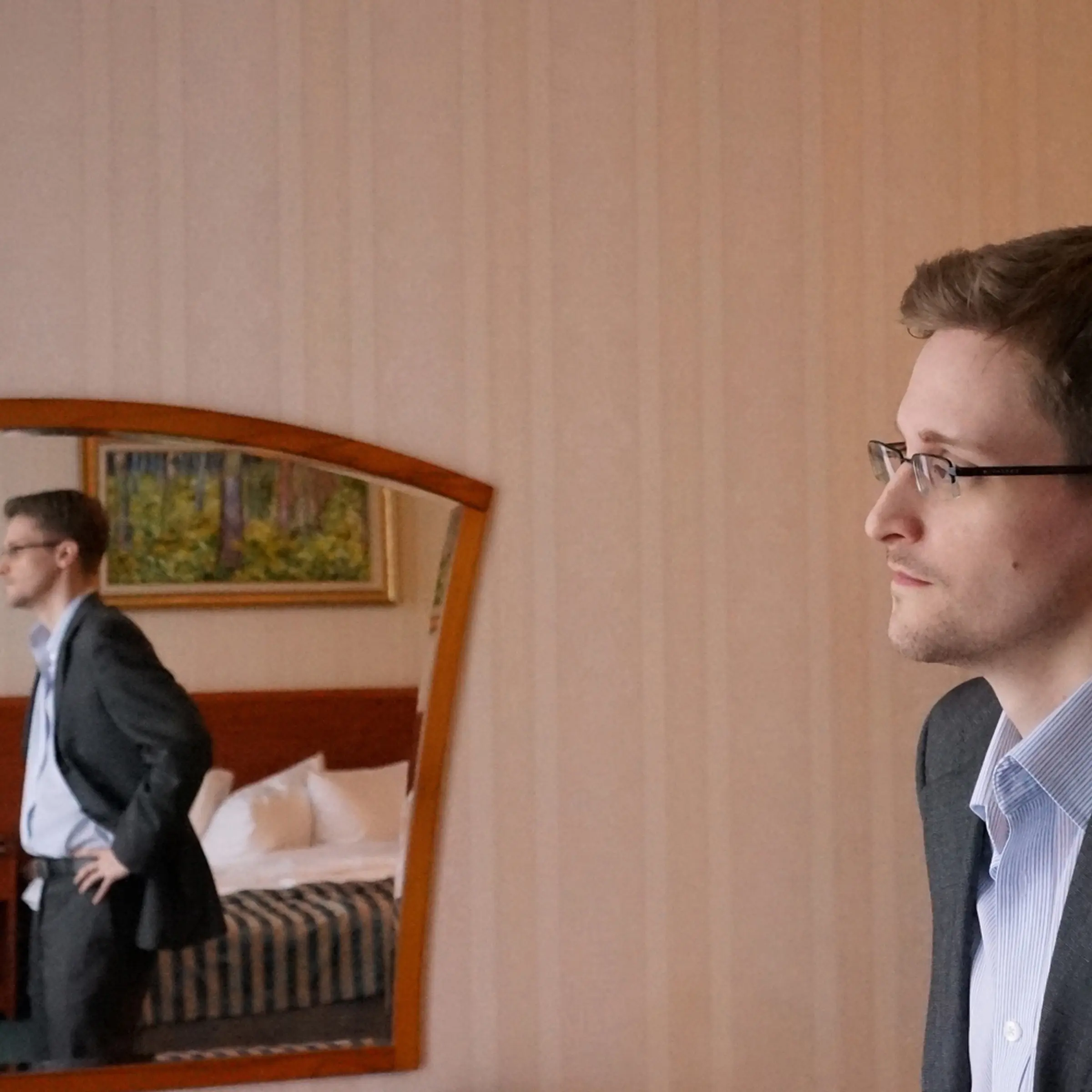 Former intelligence contractor Edward Snowden poses for a photo during an interview in an undisclosed location in December 2013 in Moscow.