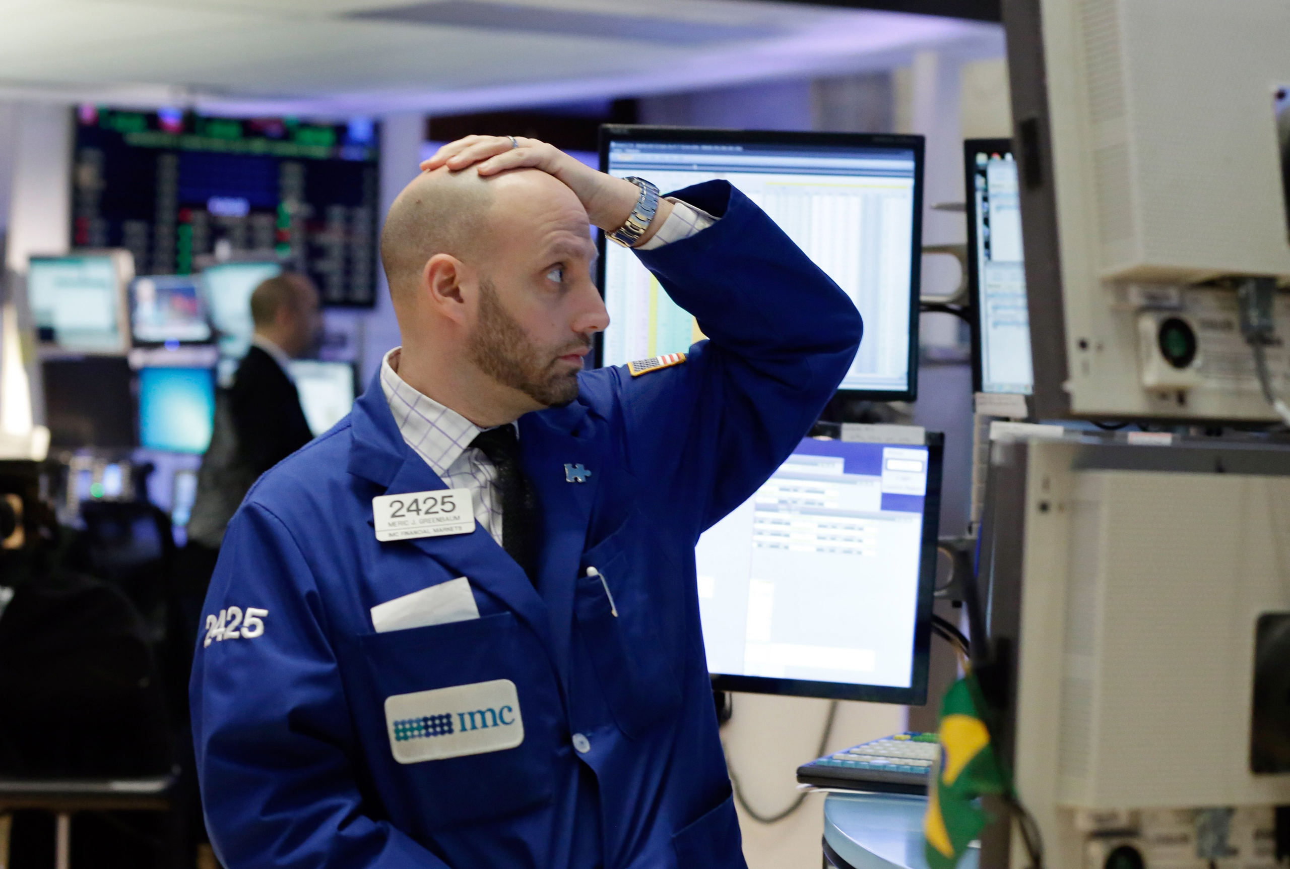 Specialist Meric Greenbaum works on the floor of the New York Stock Exchange, Monday, Jan. 4, 2016. U.S. stocks are opening 2016 on a grim note, dropping sharply after a plunge in China and declines in Europe.