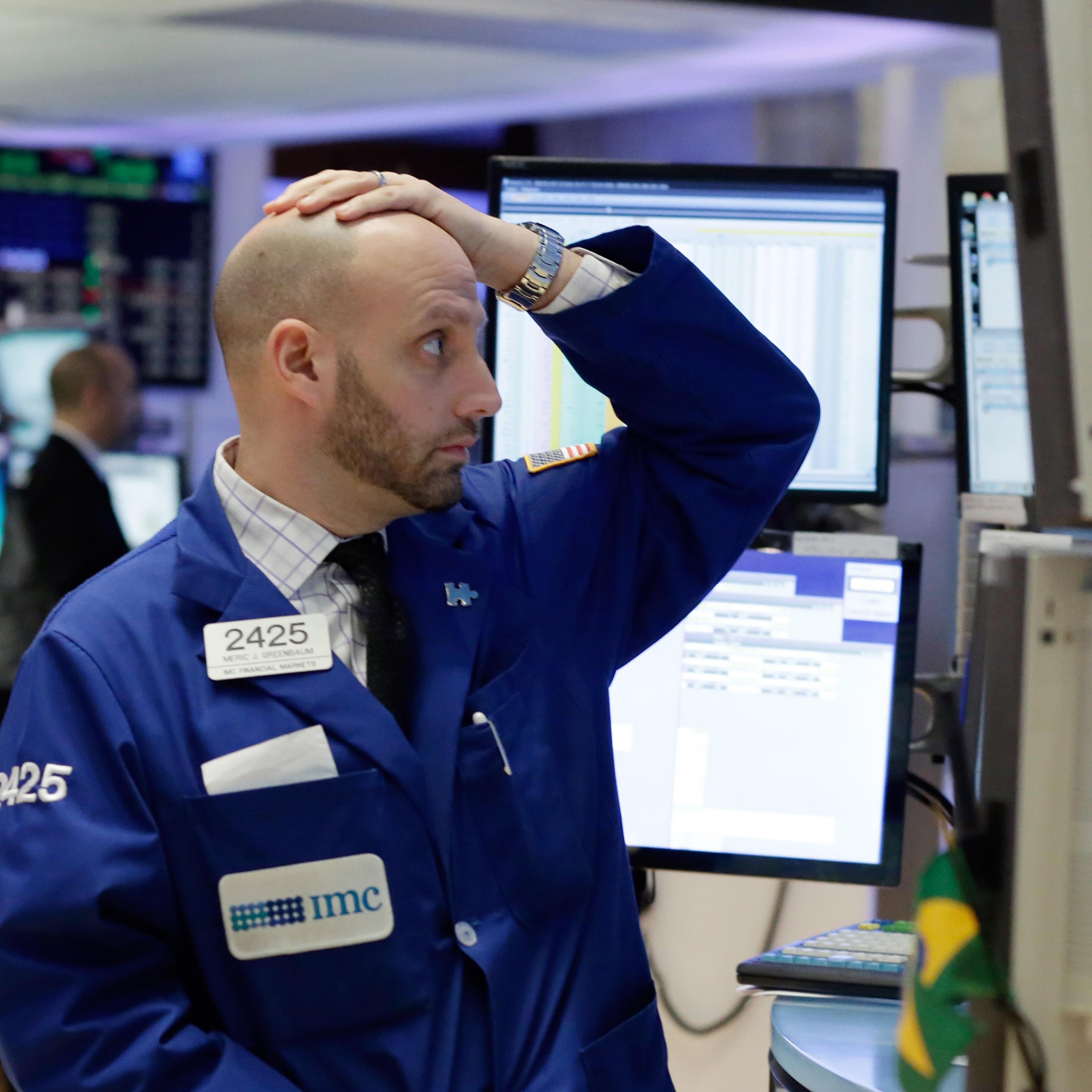 Specialist Meric Greenbaum works on the floor of the New York Stock Exchange, Monday, Jan. 4, 2016. U.S. stocks are opening 2016 on a grim note, dropping sharply after a plunge in China and declines in Europe.