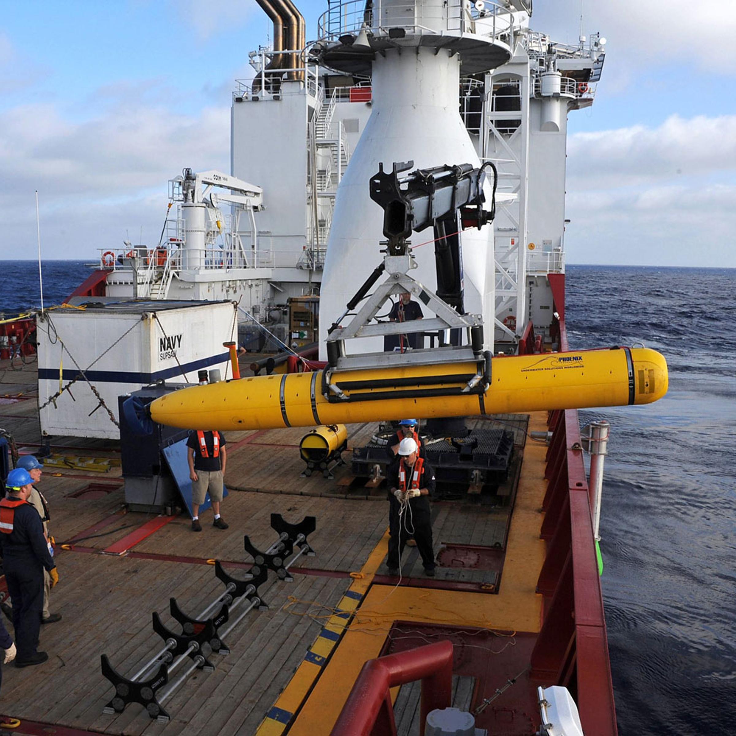Crew aboard the Australian Defence Vessel Ocean Shield move the U.S. Navyís Bluefin-21 into position for deployment, in the southern Indian Ocean to look for the missing Malaysian Airlines flight MH370