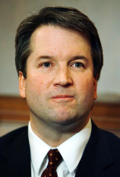 A headshot of Kavanaugh making a stern facial expression.