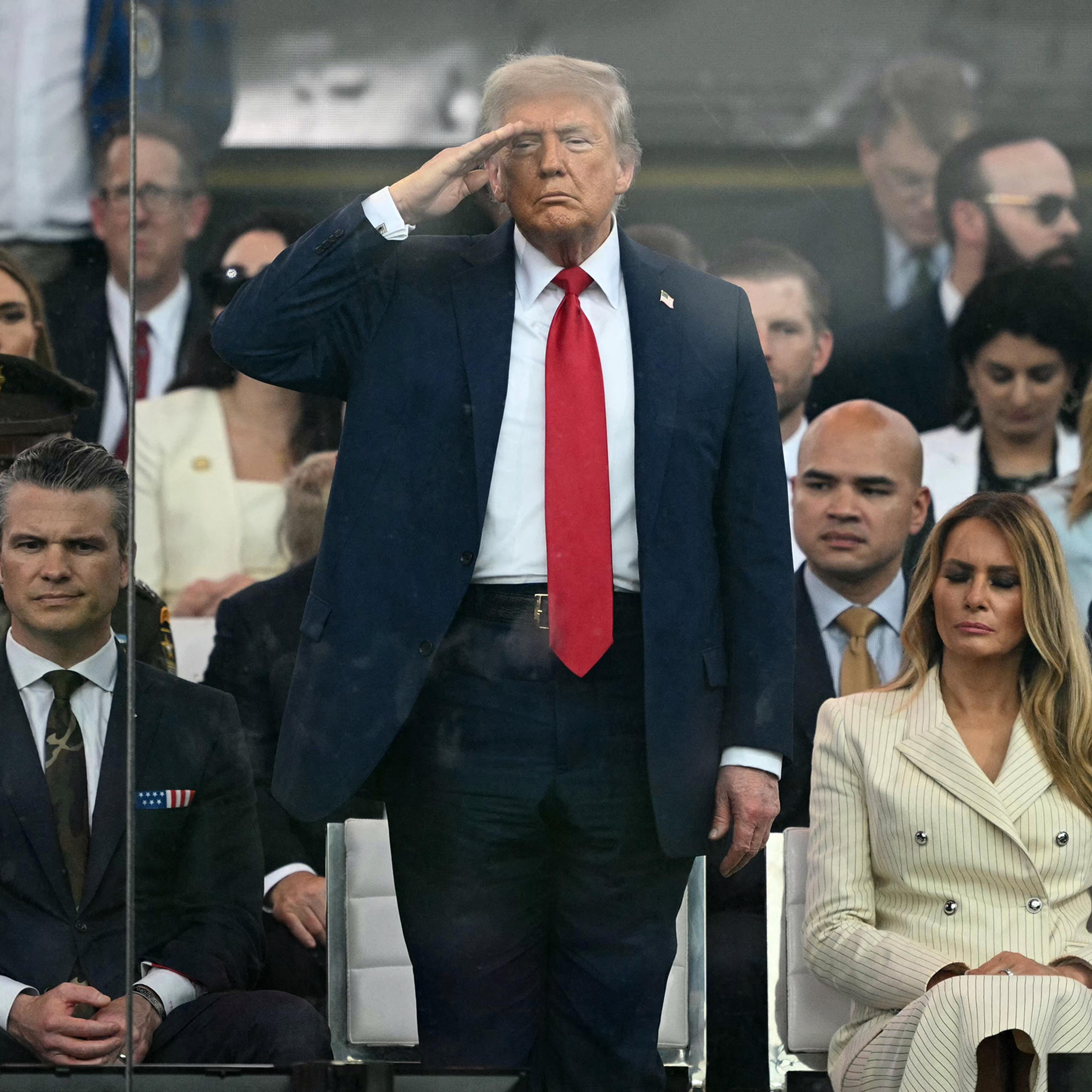 President Donald Trump, first lady Melania Trump, and Defense Secretary Pete Hegseth, left, attend a military parade commemorating the Army's 250th anniversary, coinciding with his 79th birthday in Washington, D.C. on June 14, 2025.