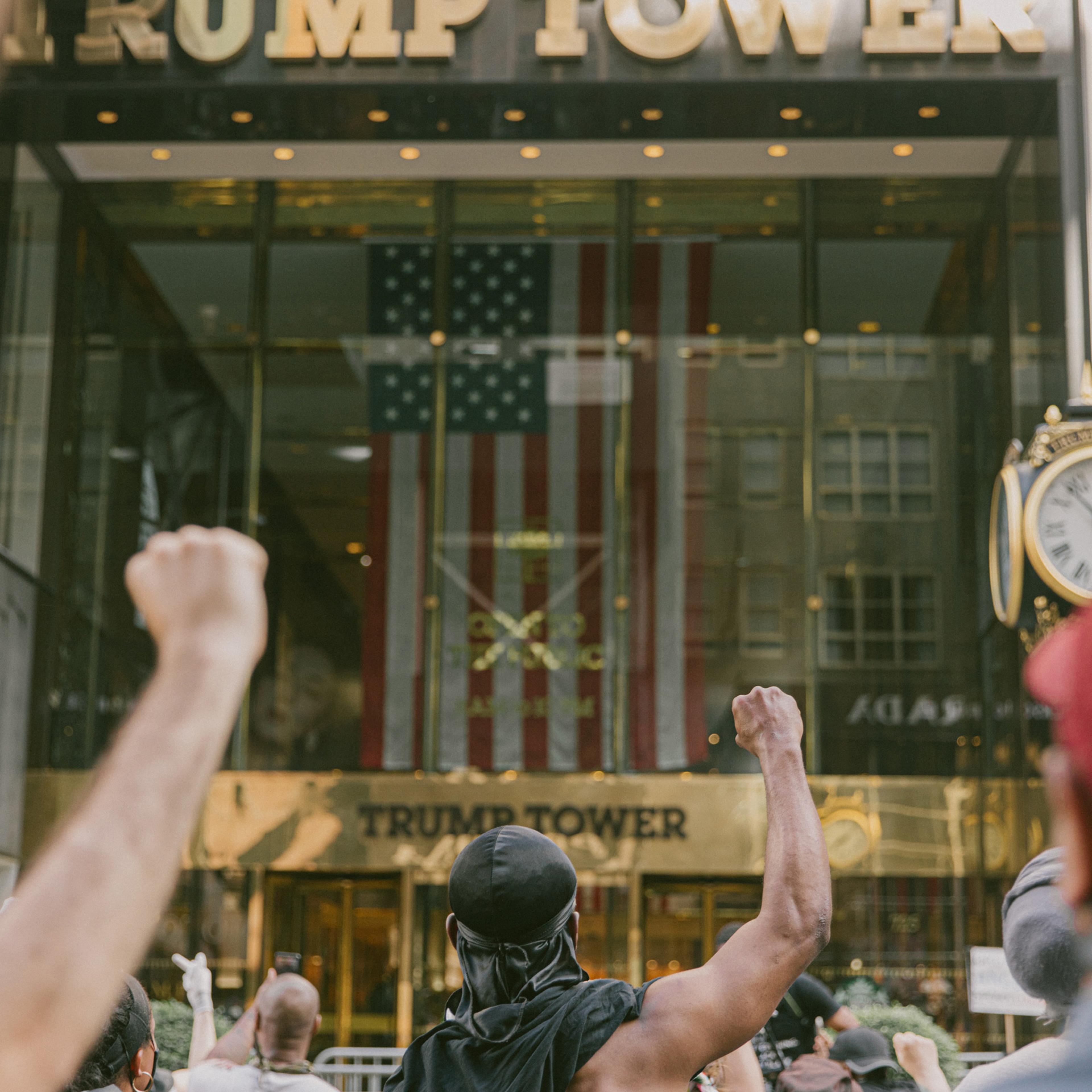Protestors marching down 5th Avenue stop and stand before Trump Tower in New York City, May 30, 2020.