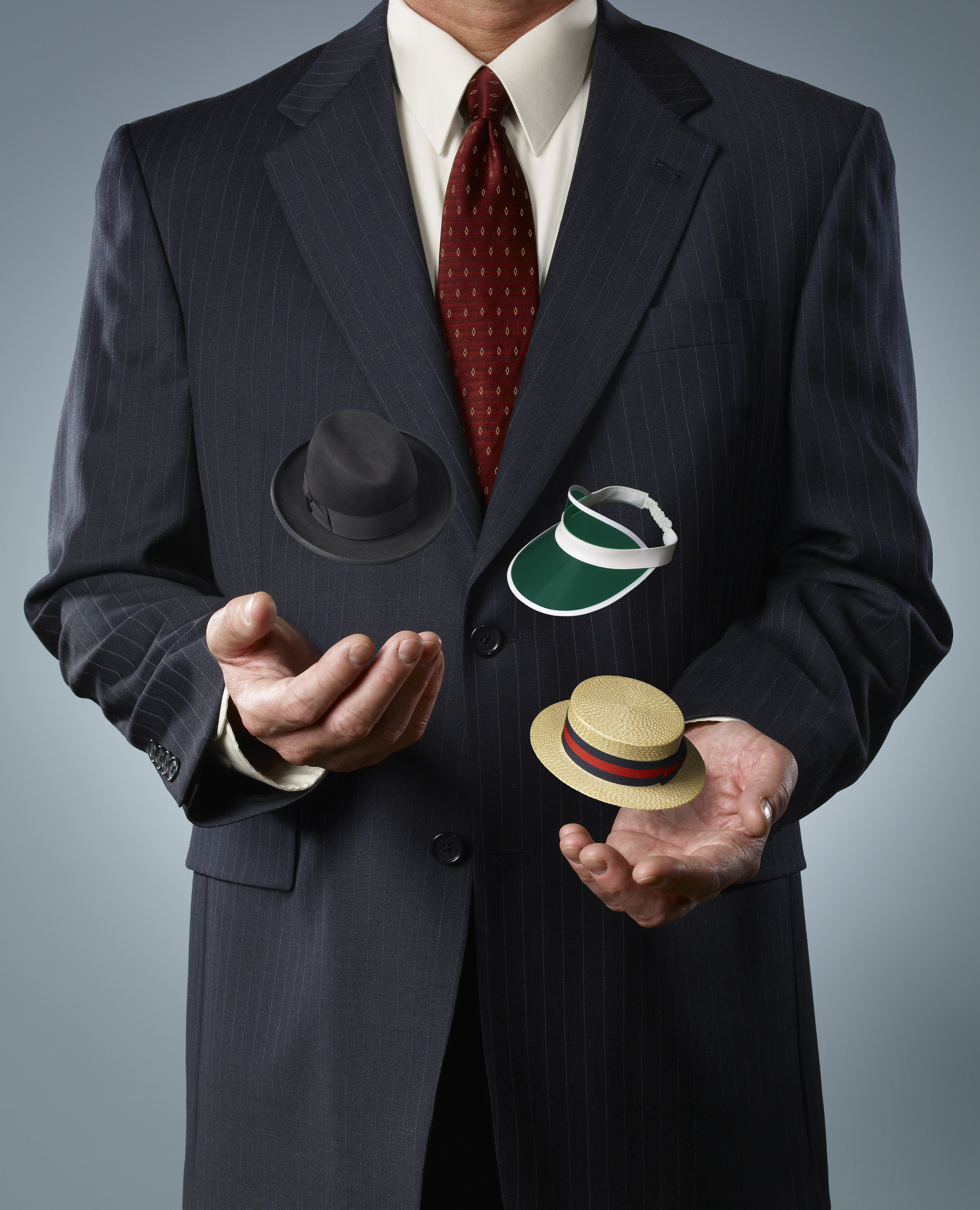 businessman-juggling-hats