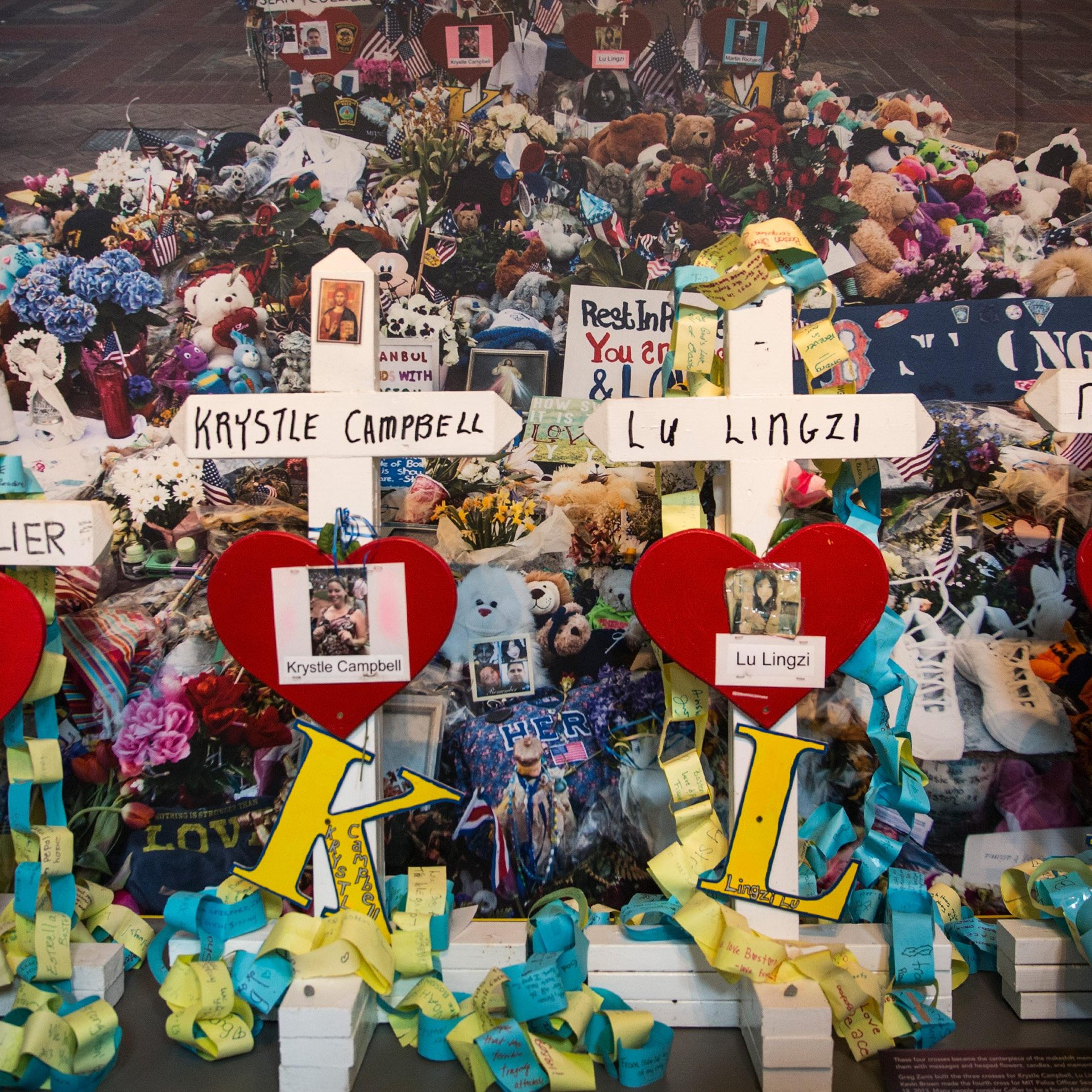 Crosses bearing the names of victims of the 2013 Boston Marathon bombing are displayed in a memorial at the Boston Public Library on April 14, 2014 in Boston.