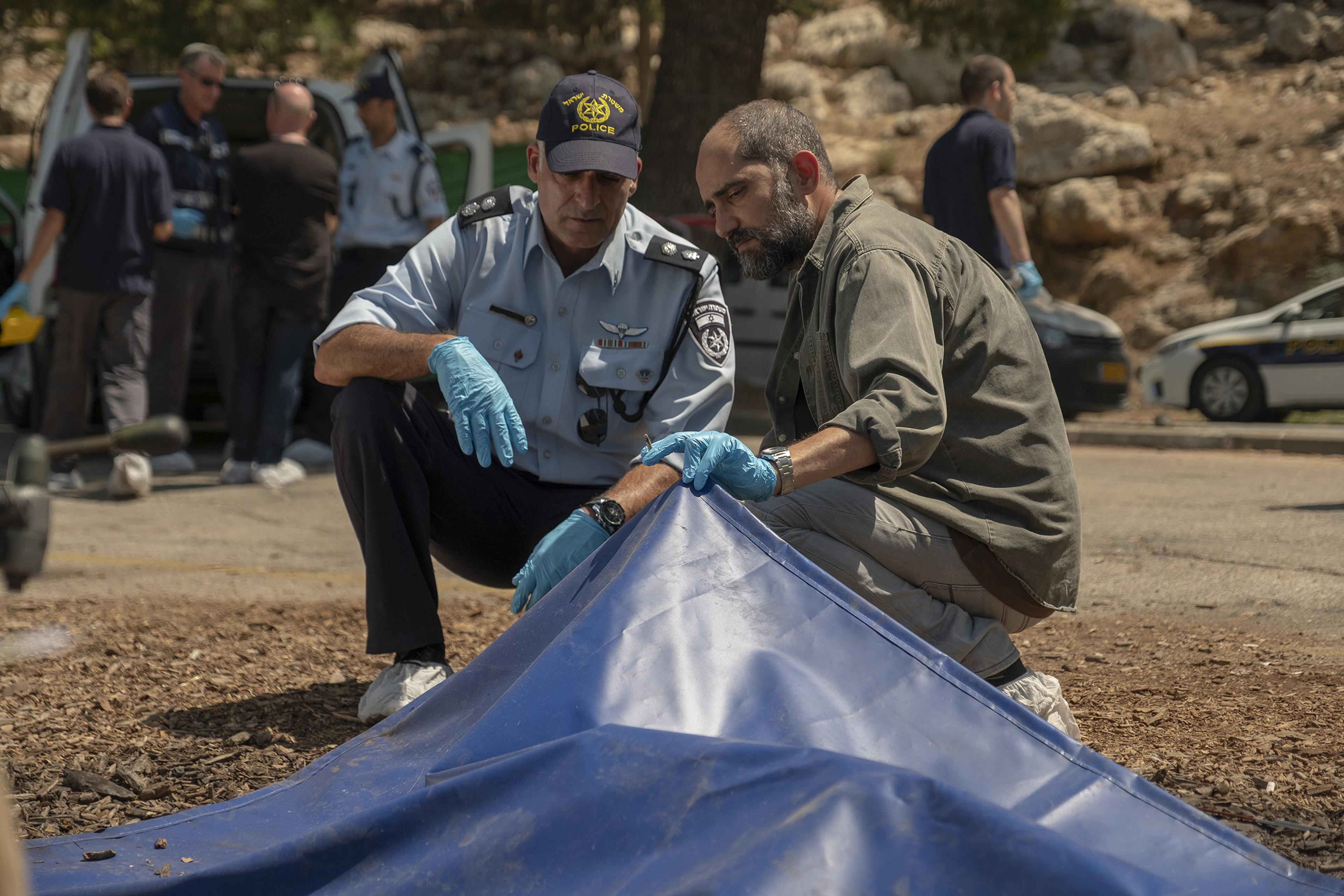 Simon (Elkabetz), right, grapples with the heavy cost of violent conflict.