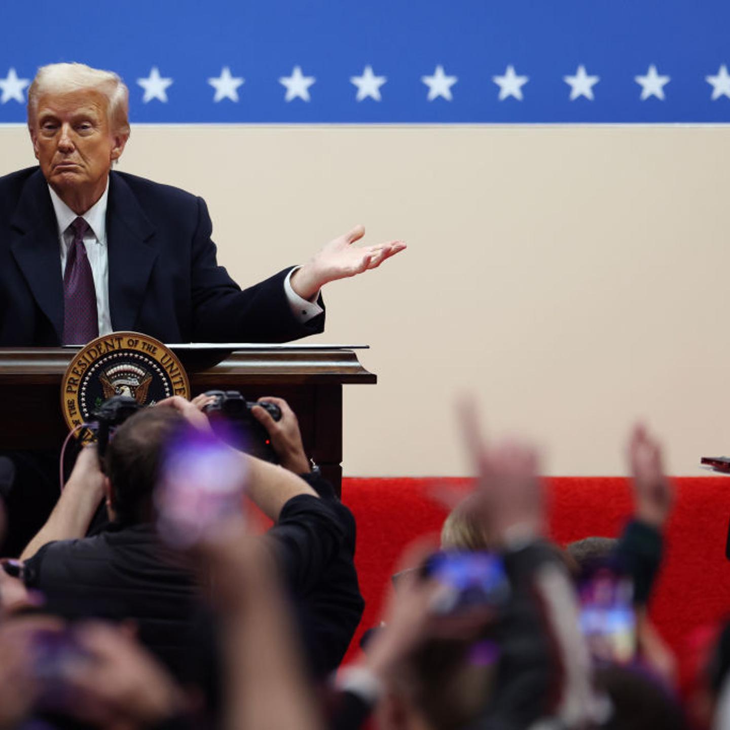 U.S. President Donald Trump gestures after signing executive orders during an indoor inauguration parade at Capital One Arena on Jan. 20, 2025 in Washington, DC.