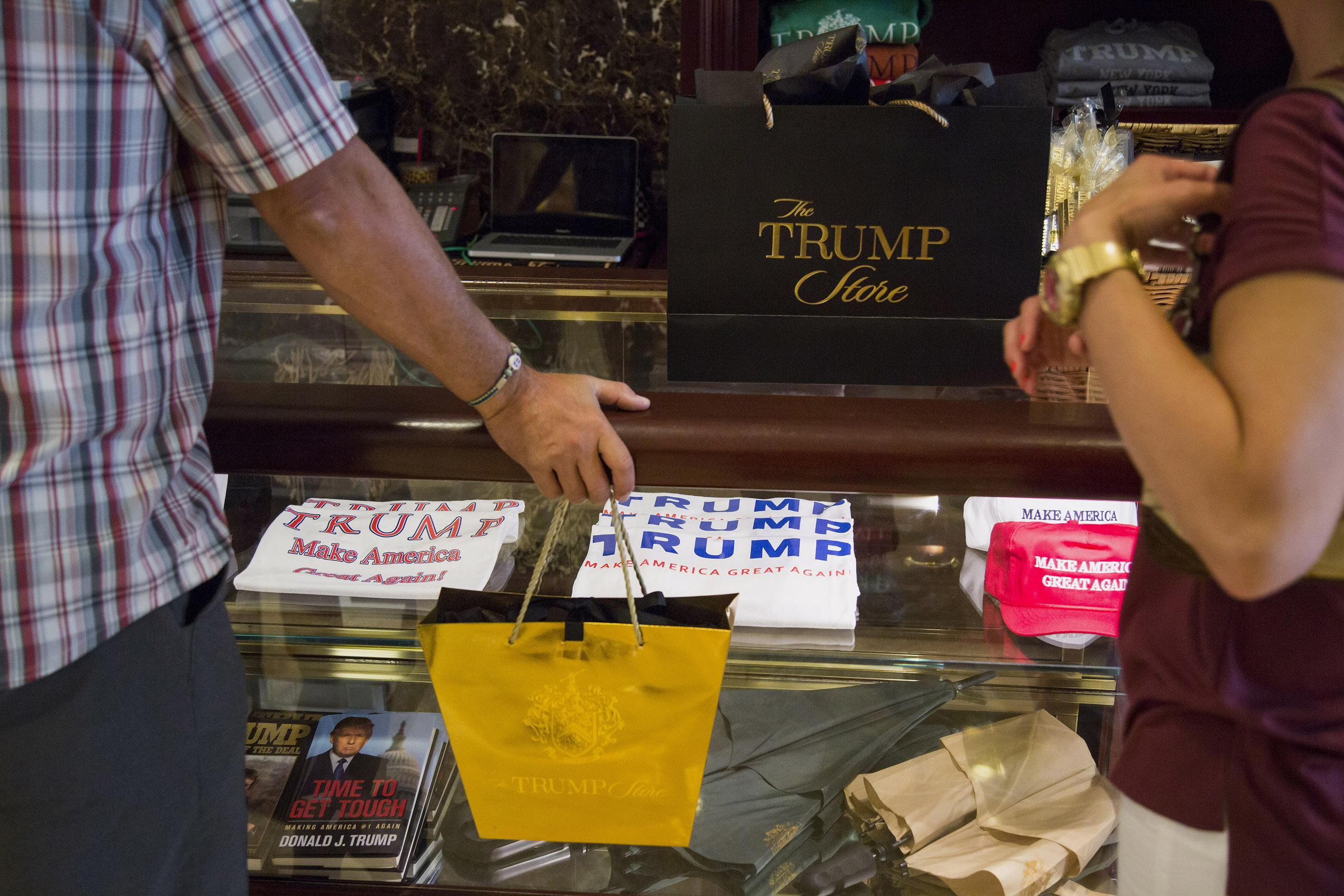 Shoppers purchase merchandise supporting Donald Trump, president and chief executive of Trump Organization Inc. and 2016 Republican presidential candidate, inside a store at Trump Tower in New York City on Aug. 26, 2015.