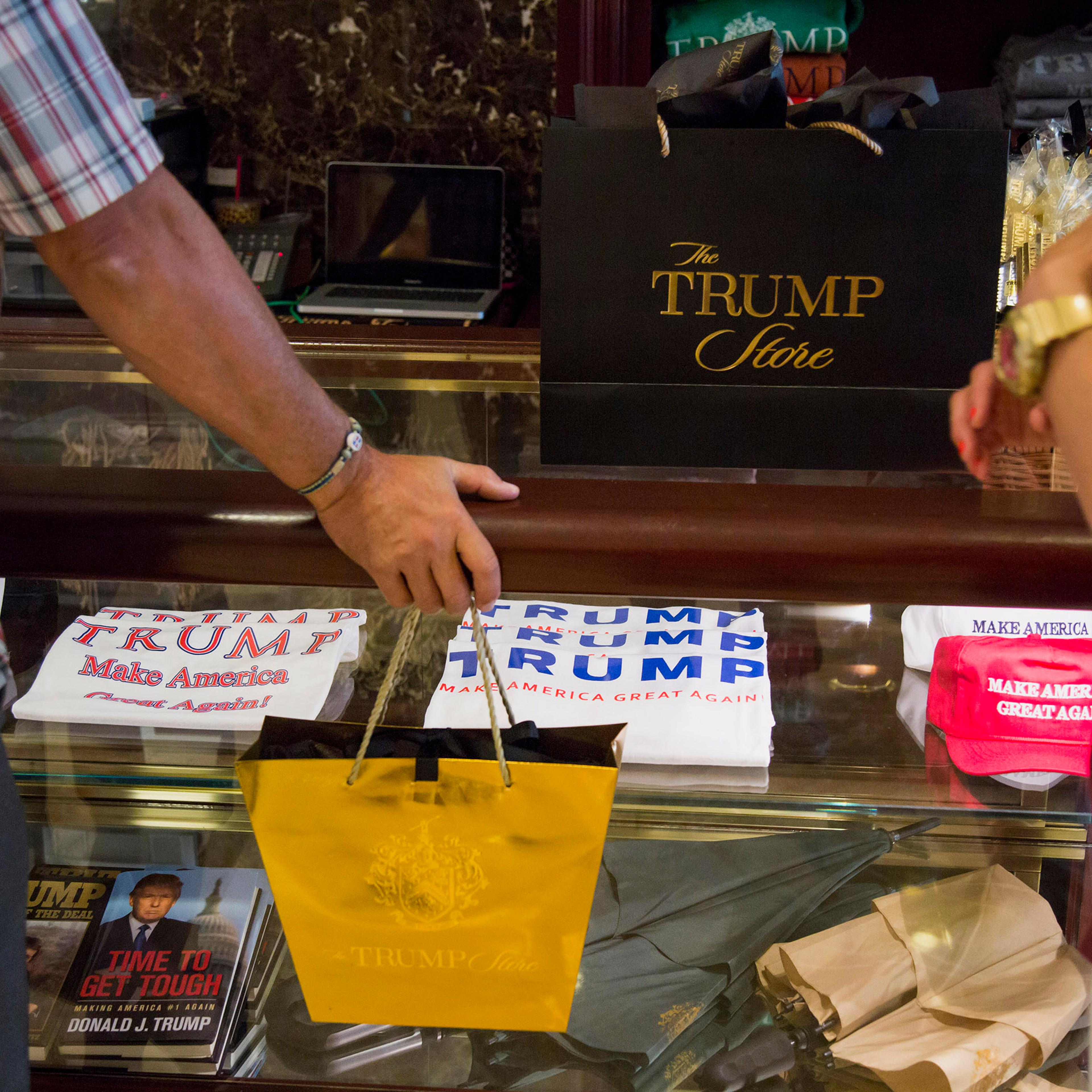 Shoppers purchase merchandise supporting Donald Trump, president and chief executive of Trump Organization Inc. and 2016 Republican presidential candidate, inside a store at Trump Tower in New York City on Aug. 26, 2015.