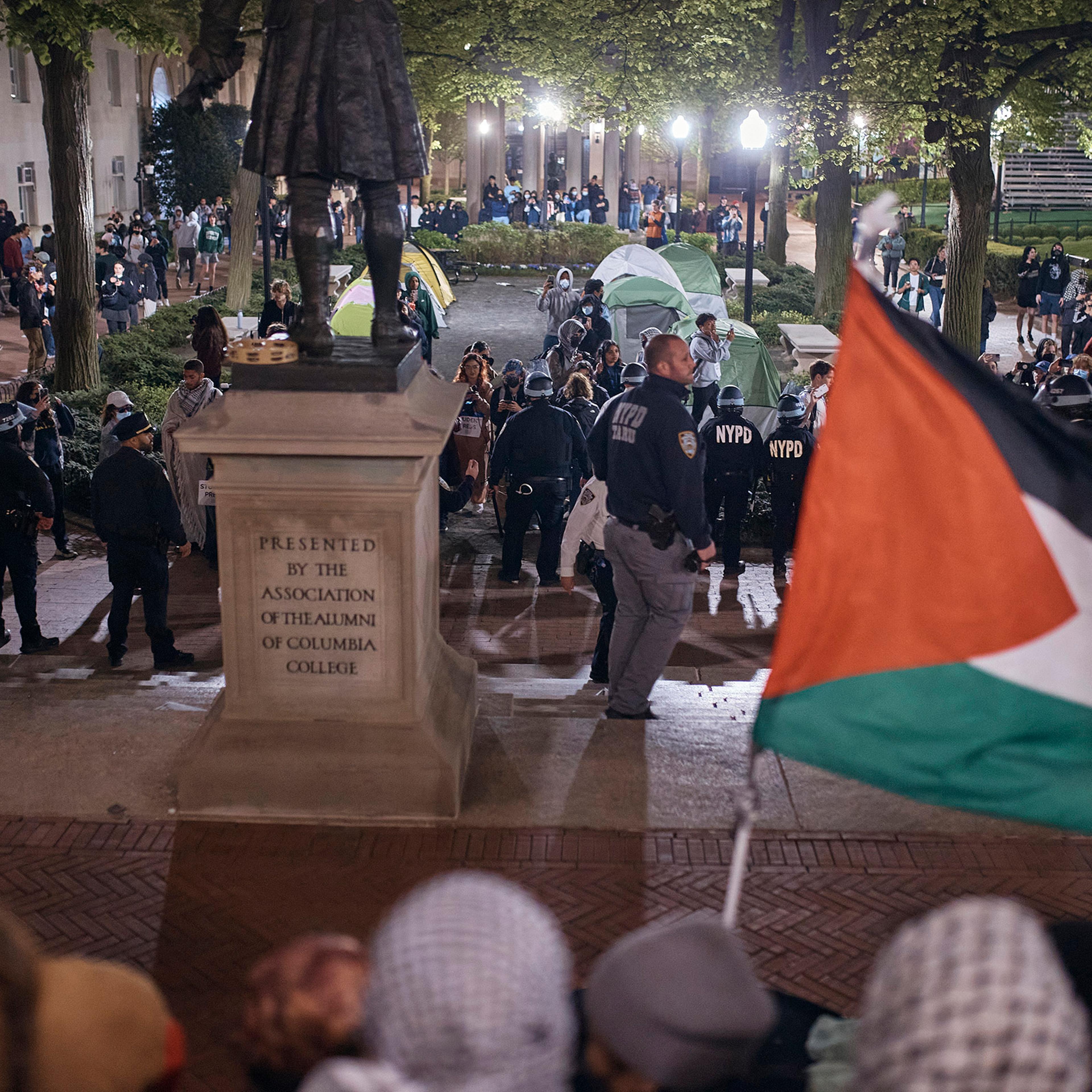 Police secure the area as protestors block the entrance to Hamilton Hall on Columbia University campus in New York City, April 30, 2024.