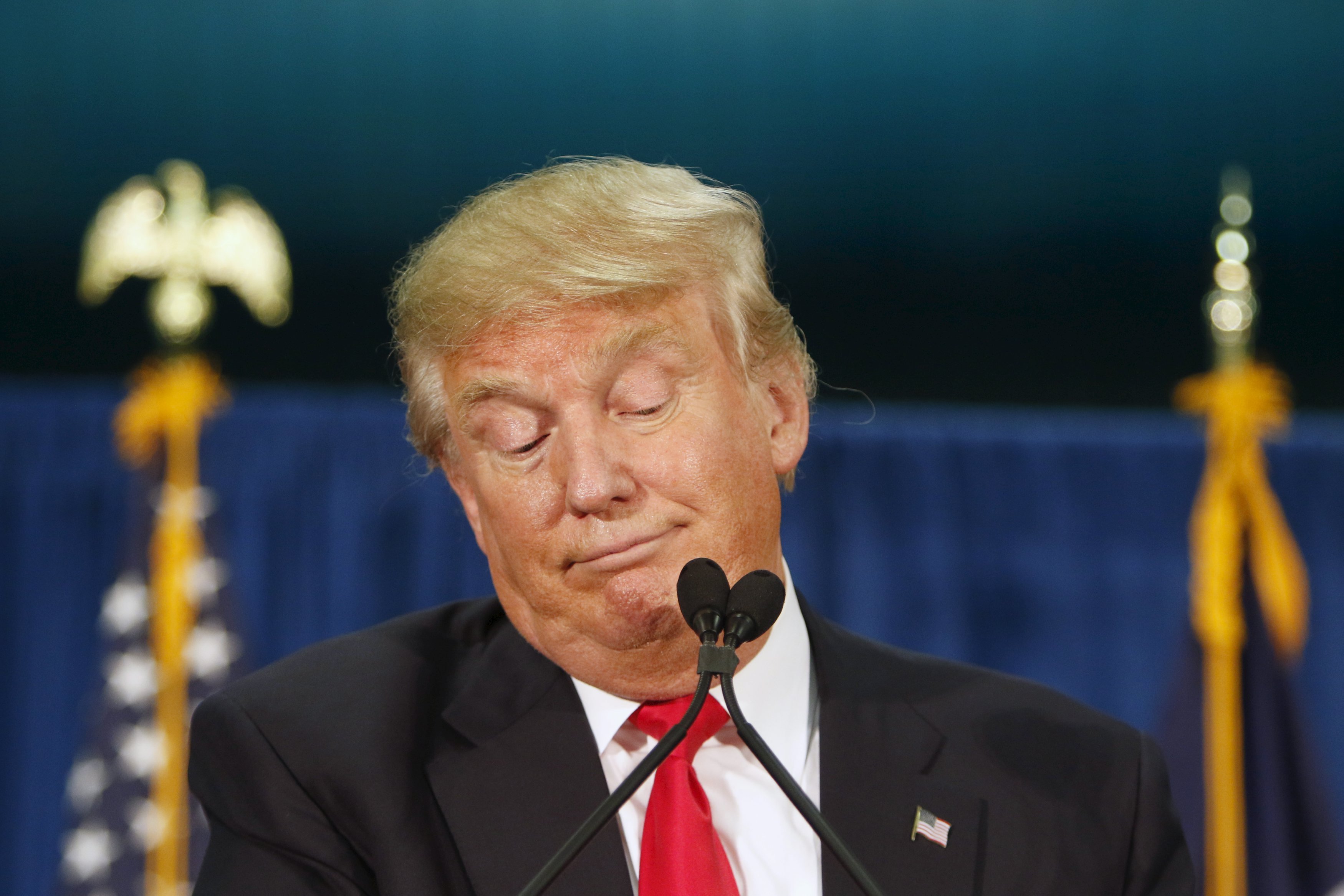 U.S. Republican presidential candidate Donald Trump stops speaking while waiting for protesters to be removed at a campaign rally at the University of Iowa in Iowa City, Iowa