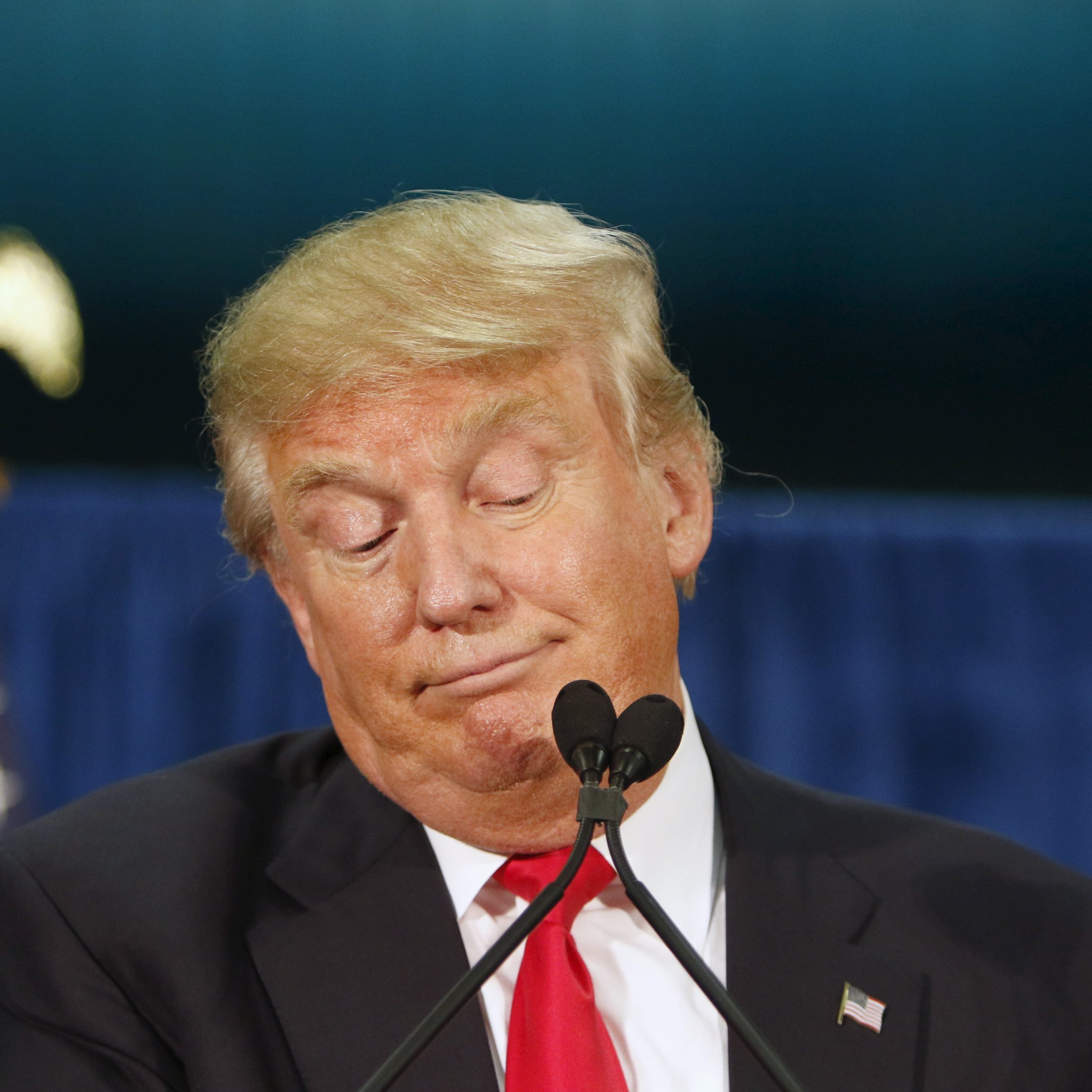 U.S. Republican presidential candidate Donald Trump stops speaking while waiting for protesters to be removed at a campaign rally at the University of Iowa in Iowa City, Iowa