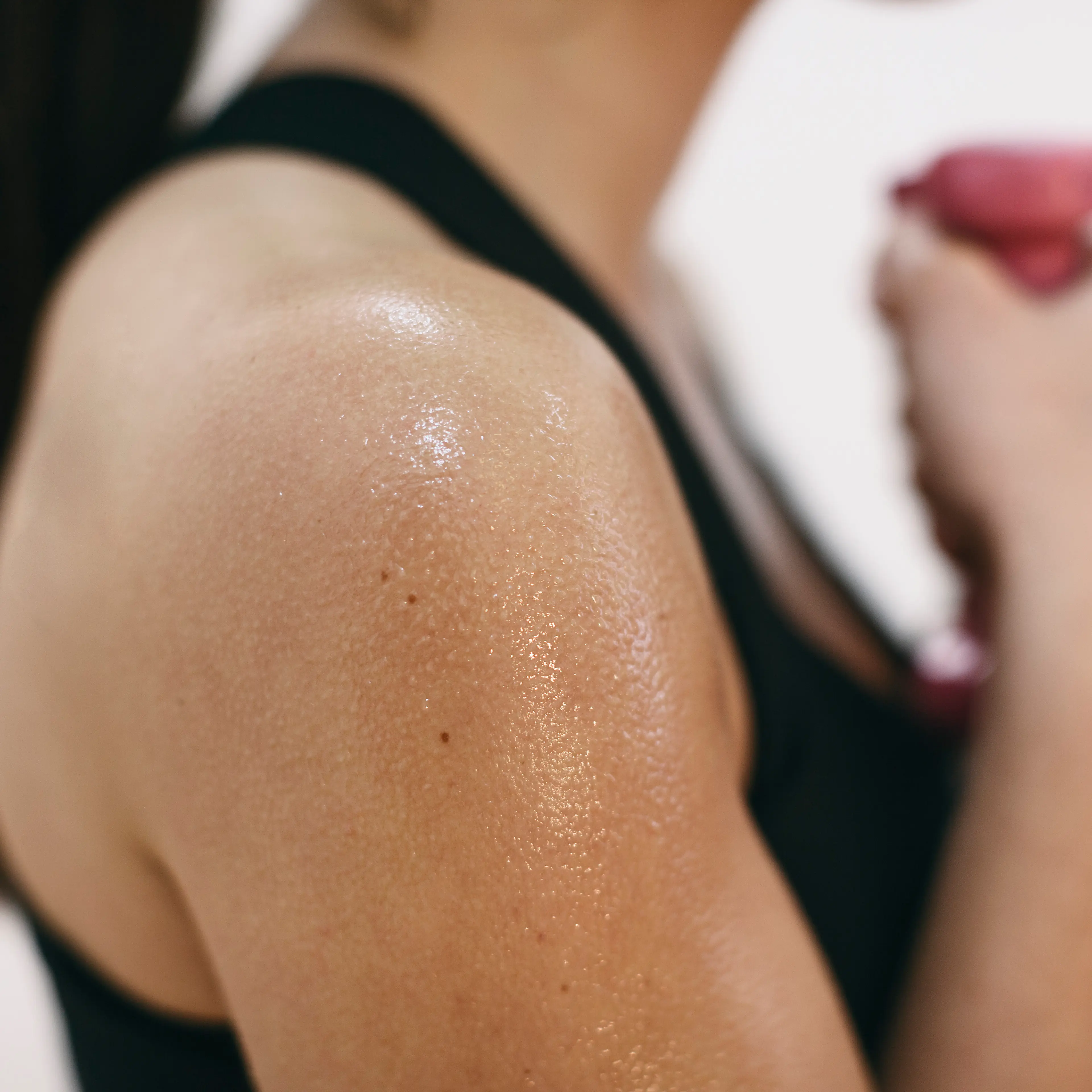 Sweaty shoulder of woman doing fitness workout TIME health stock