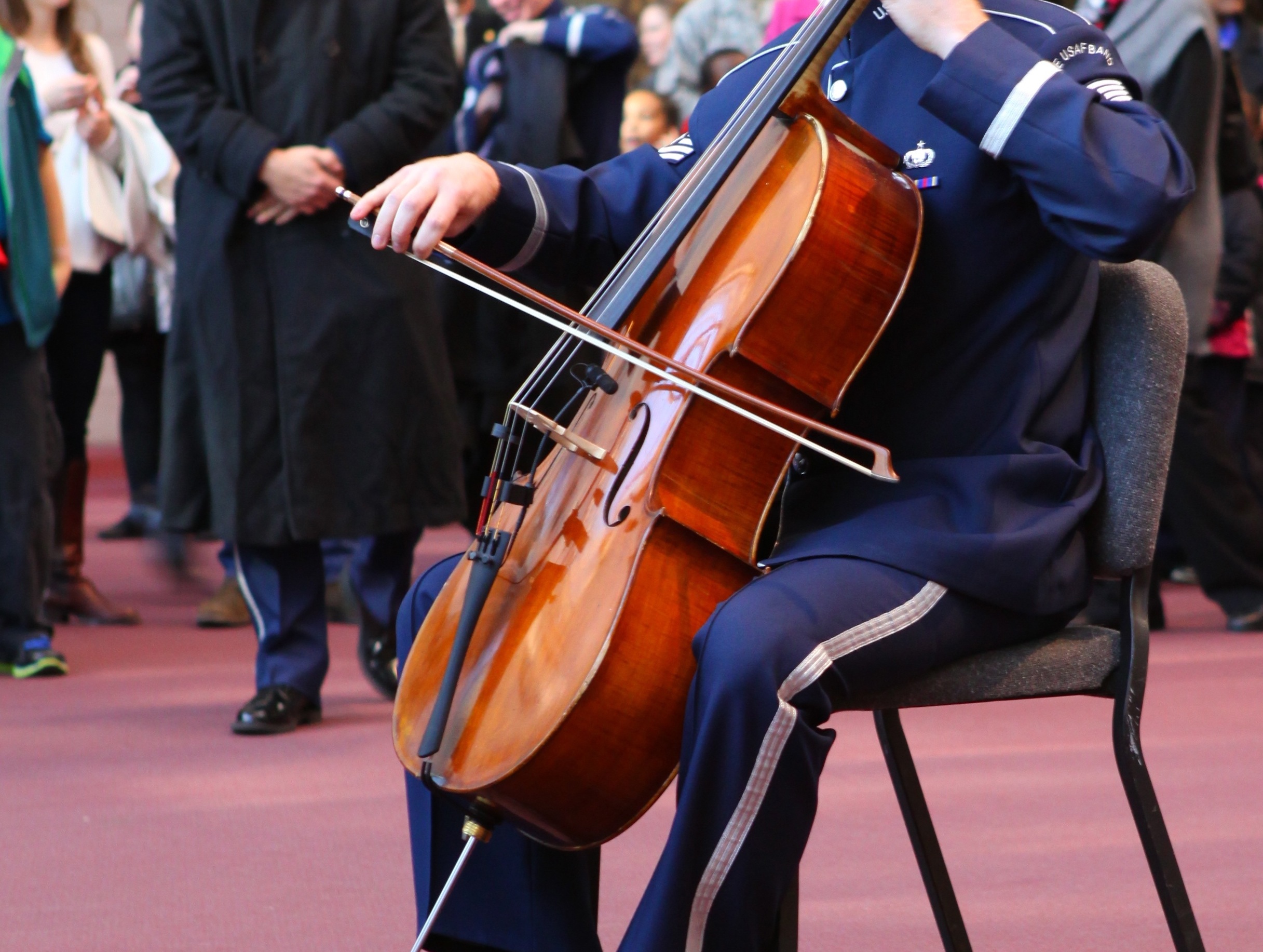 A member of the Air Force Band plays a cello.