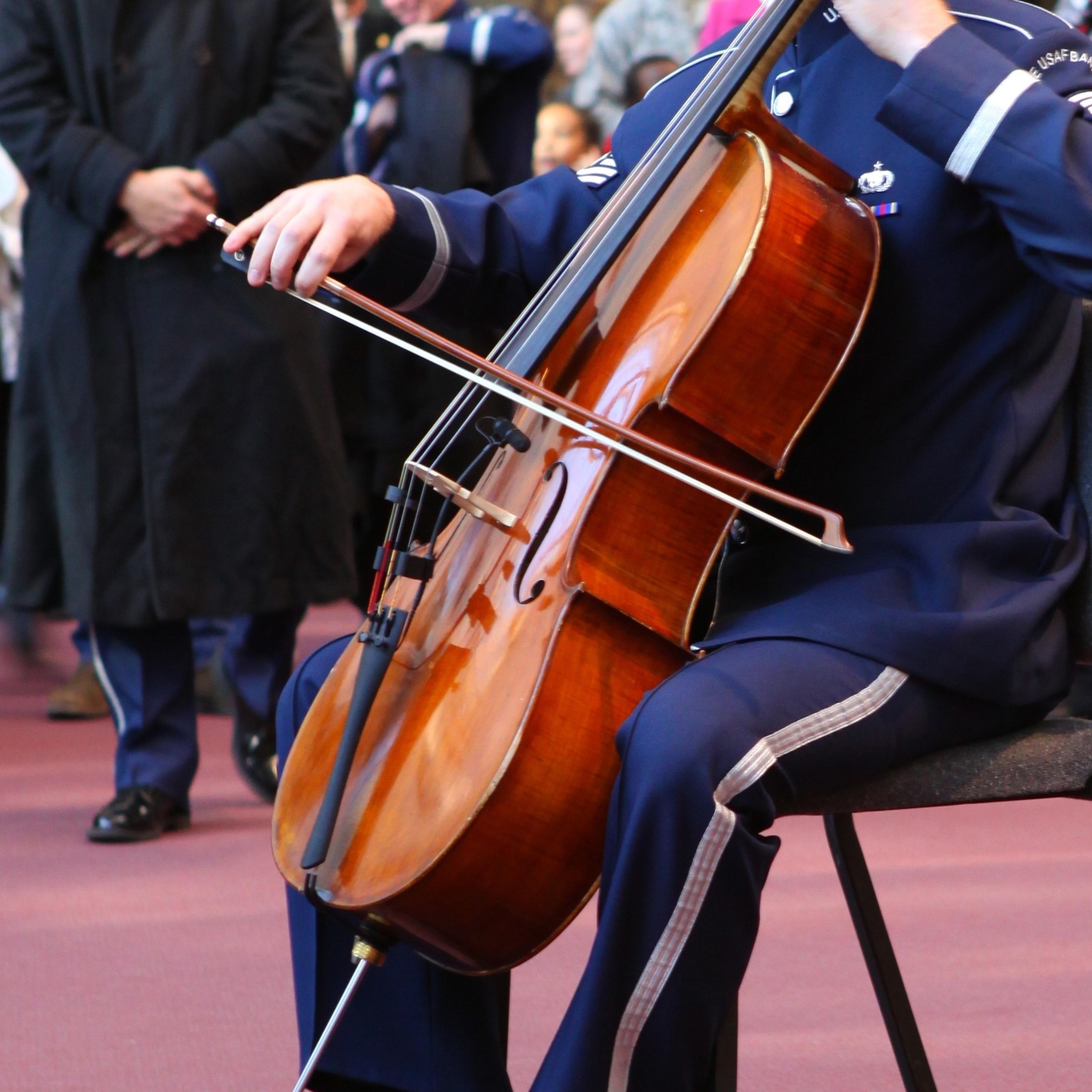 A member of the Air Force Band plays a cello.