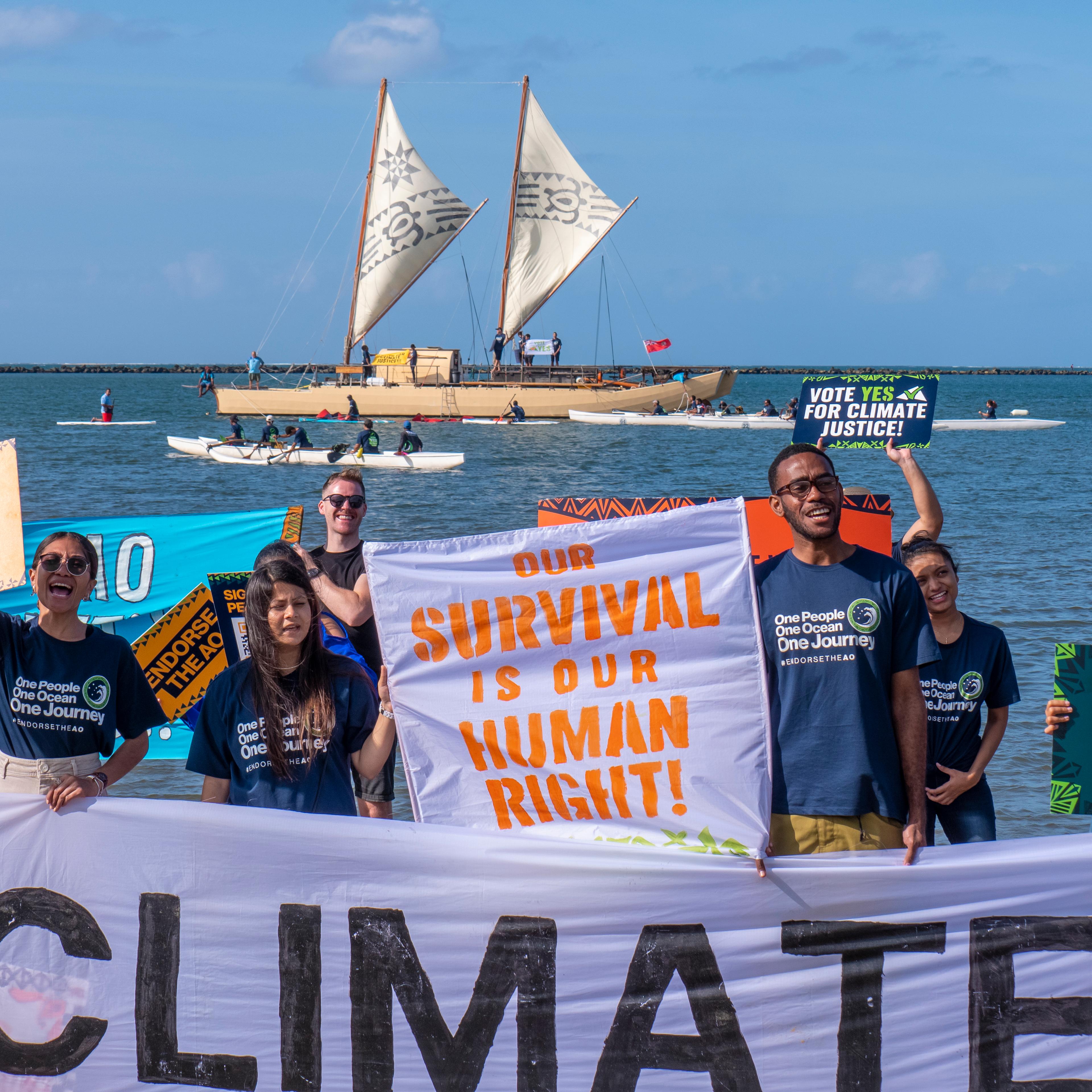 Climate activists call on Pacific Islands leaders to endorse Vanuatu's push for the International Court of Justice to issue an advisory opinion on climate change in Suva, Fiji on July 9, 2022.