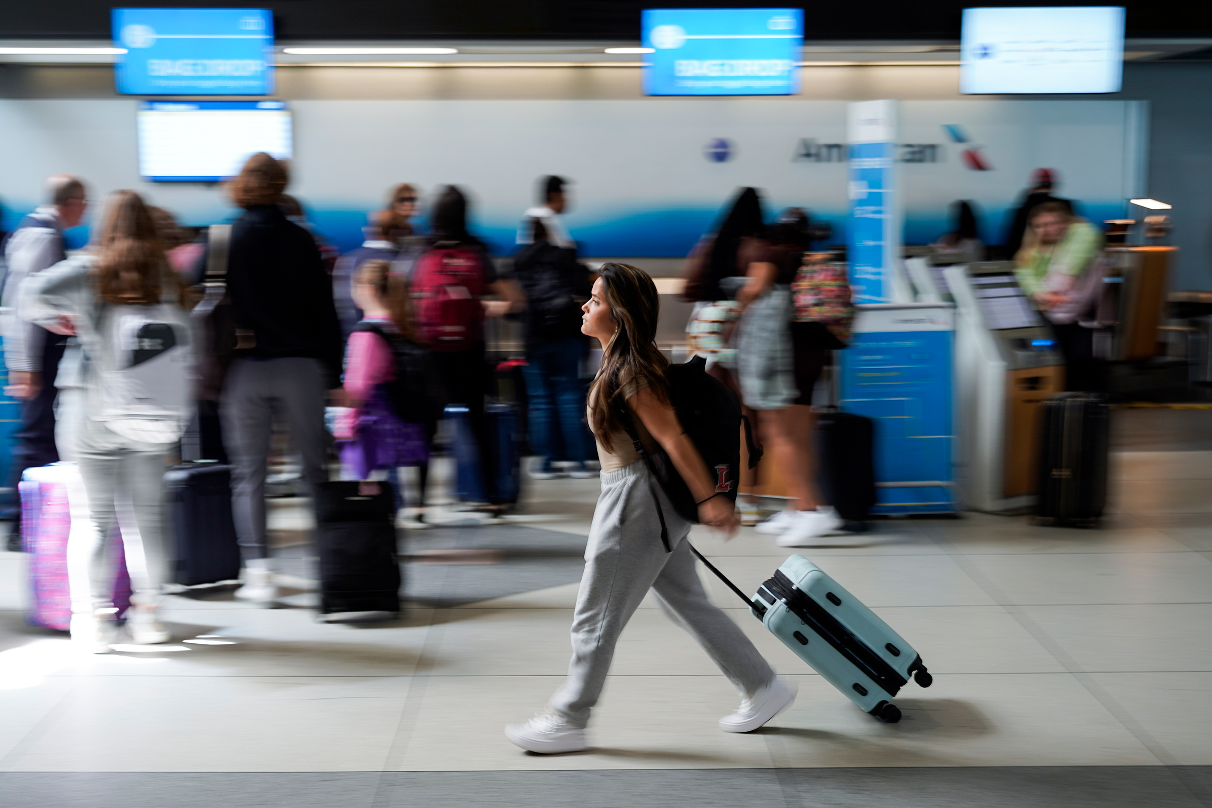 A person walks by the ticketing lobby at the Charlotte Douglas International Airport on May 25, 2023, in Charlotte, N.C.