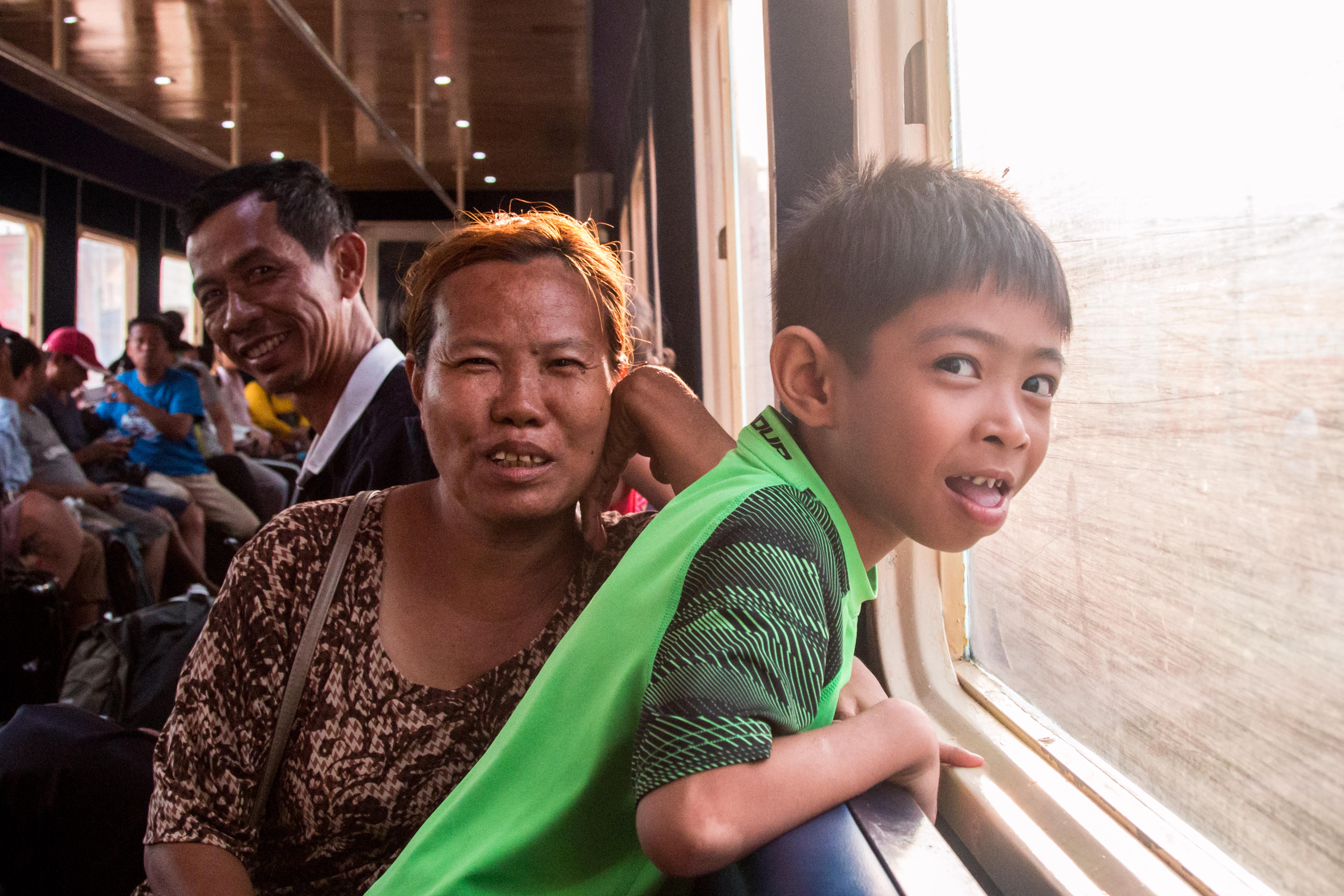 The thrill of the ride. Passengers seeking respite from the heat ride Phnom Penh's new airport shuttle train.