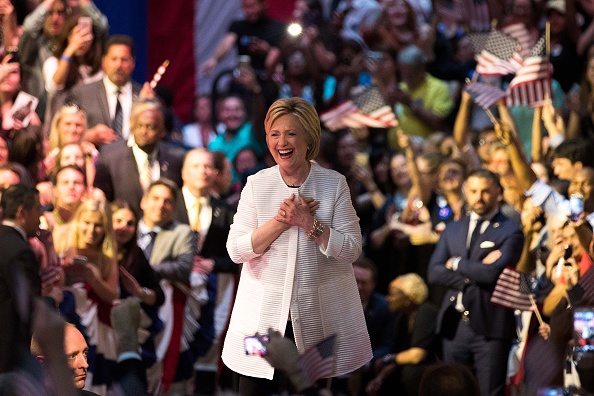 Democratic presidential candidate Hillary Clinton arrives onstage during a primary night rally at the Duggal Greenhouse in the Brooklyn Navy Yard, June 7, 2016 in the Brooklyn borough of New York City.