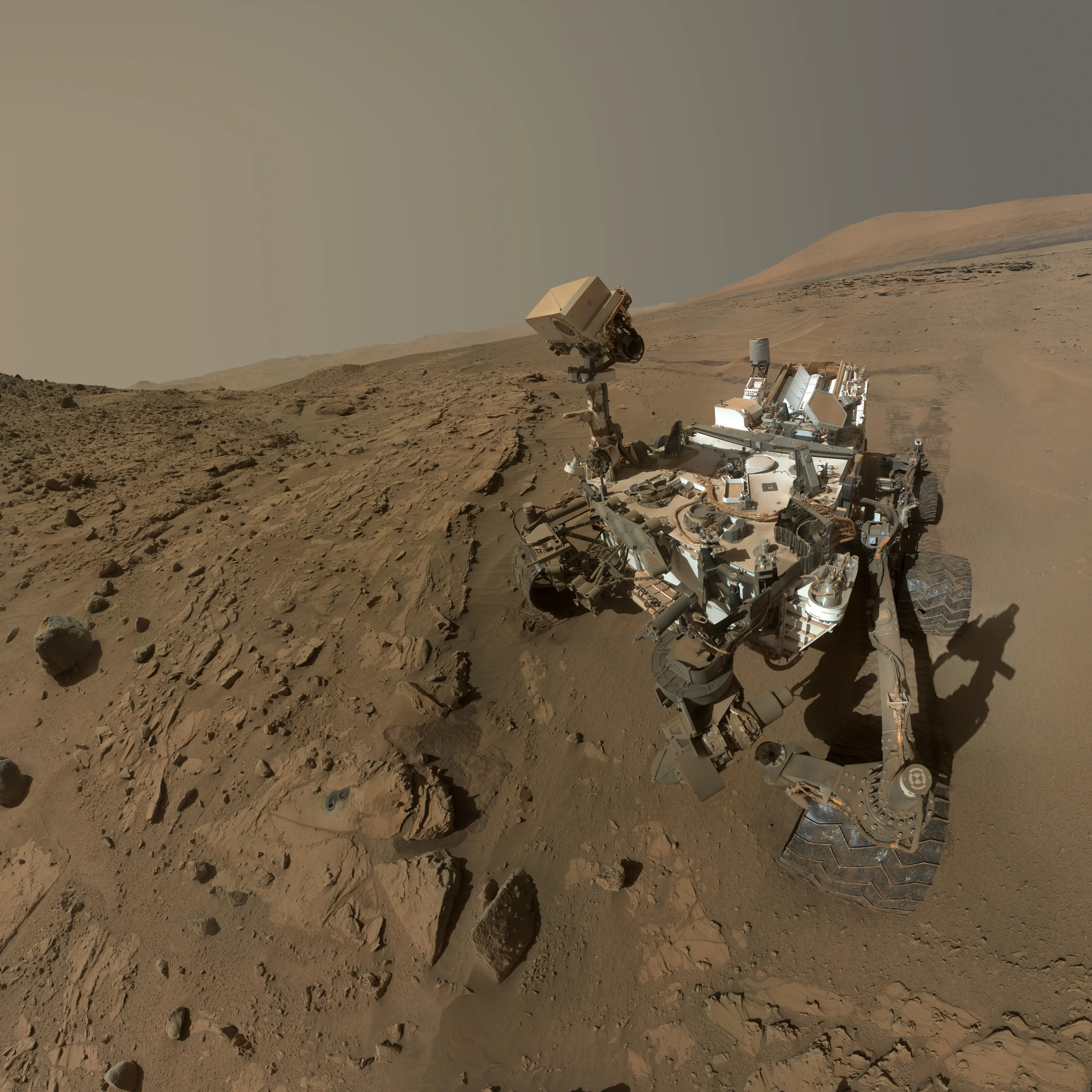 NASA's Curiosity Mars rover used the camera at the end of its arm in April and May 2014 to take dozens of component images combined into this self-portrait where the rover drilled into a sandstone target called "Windjana." The camera is the Mars Hand Lens Imager (MAHLI).