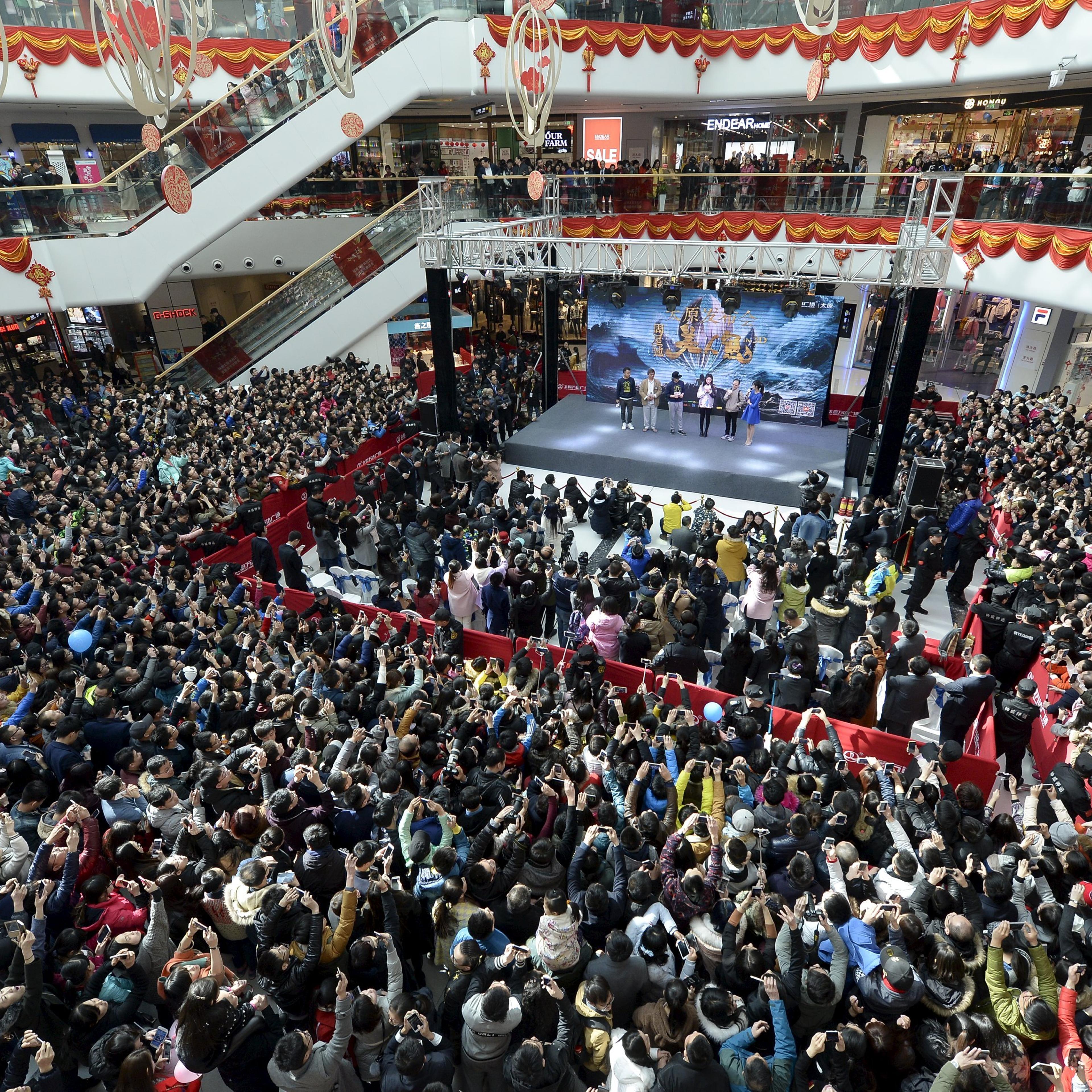 People attend a promotional event with Hong Kong star Stephen Chow for the film, The Mermaid, in Taiyuan