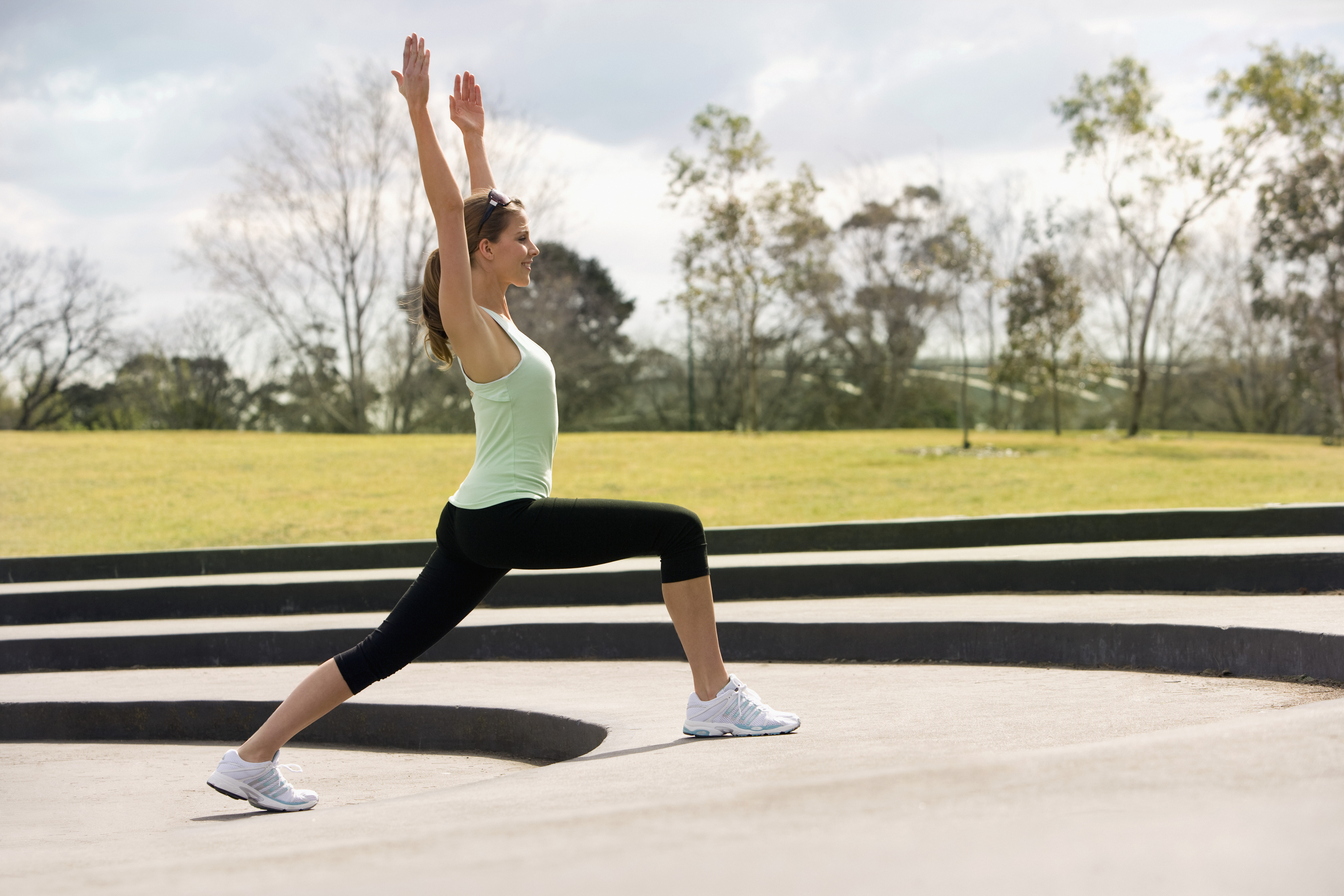 Woman Practicing Yoga in Park