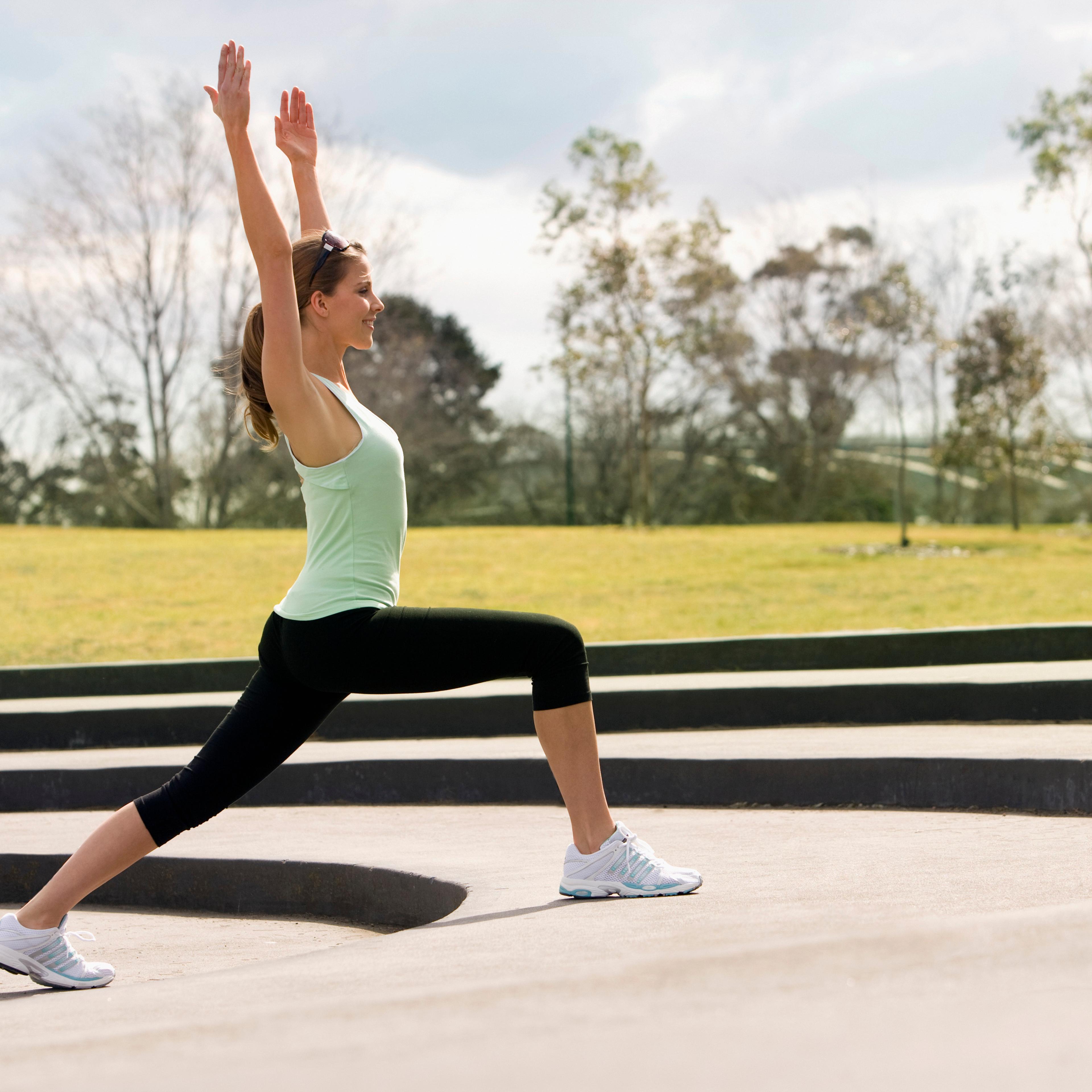 Woman Practicing Yoga in Park
