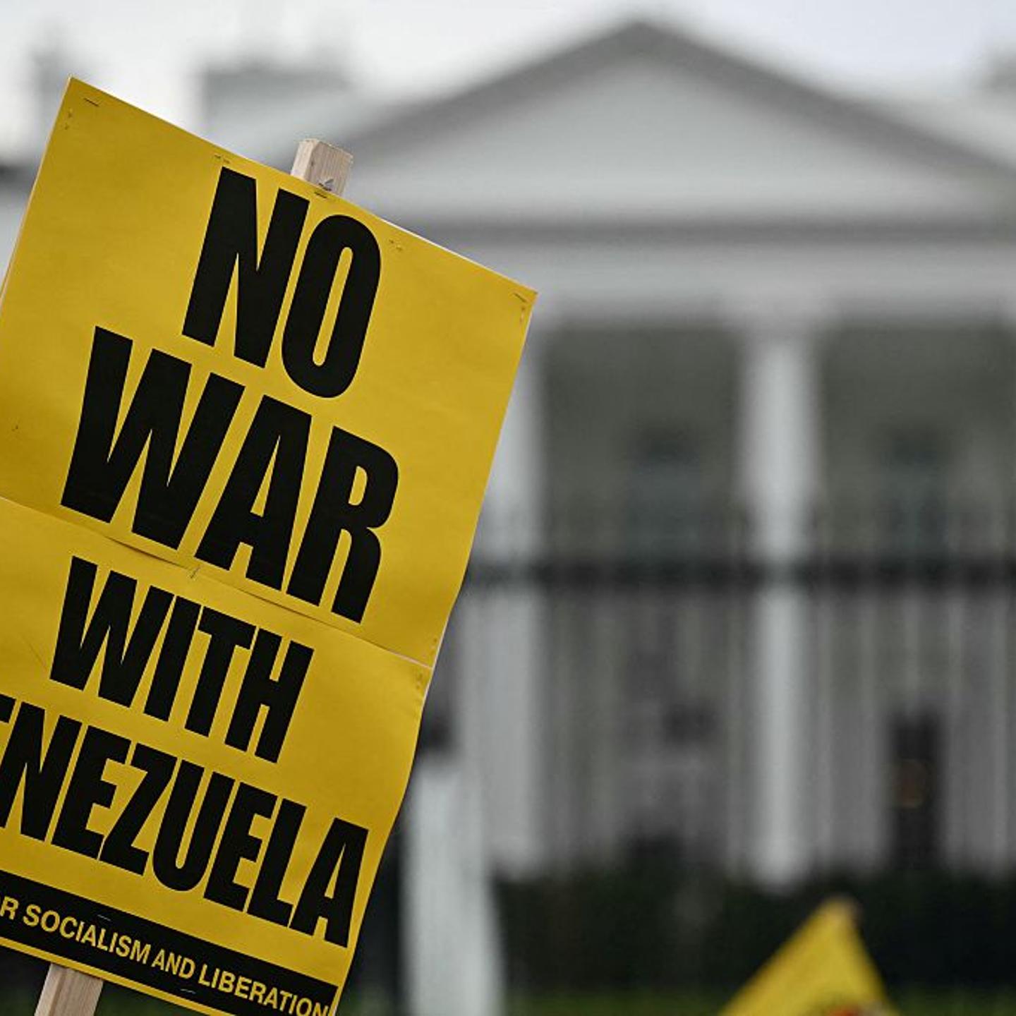 People take part in a "Peace with Venezuela" protest against the U.S. military deployment in Latin America in front of the White House in Washington, DC, on Nov. 15, 2025.