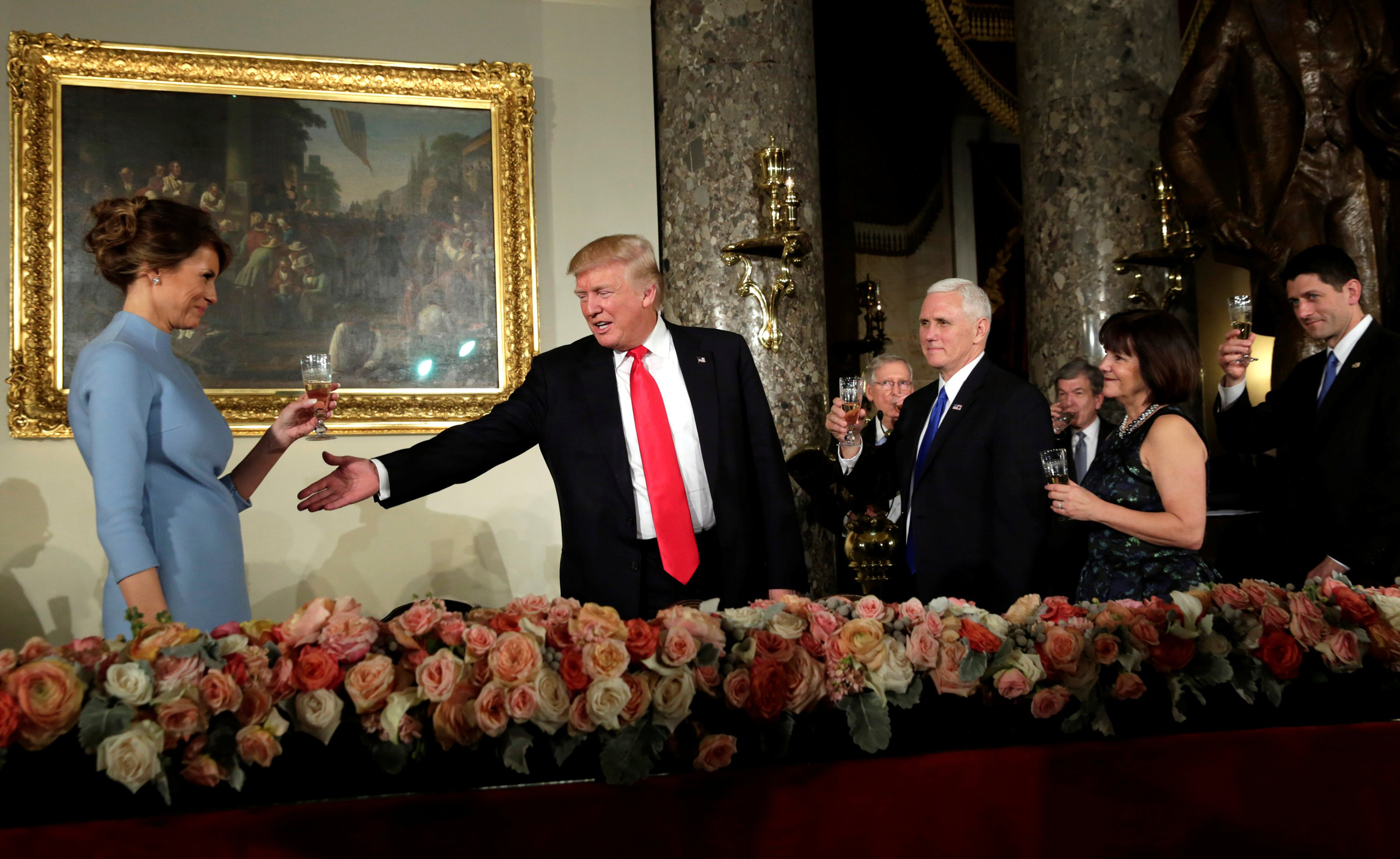 U.S. President Donald Trump gestures during a toast at the Inaugural luncheon at the National Statuary Hall in Washington, U.S, January 20, 2017. REUTERS/Yuri Gripas