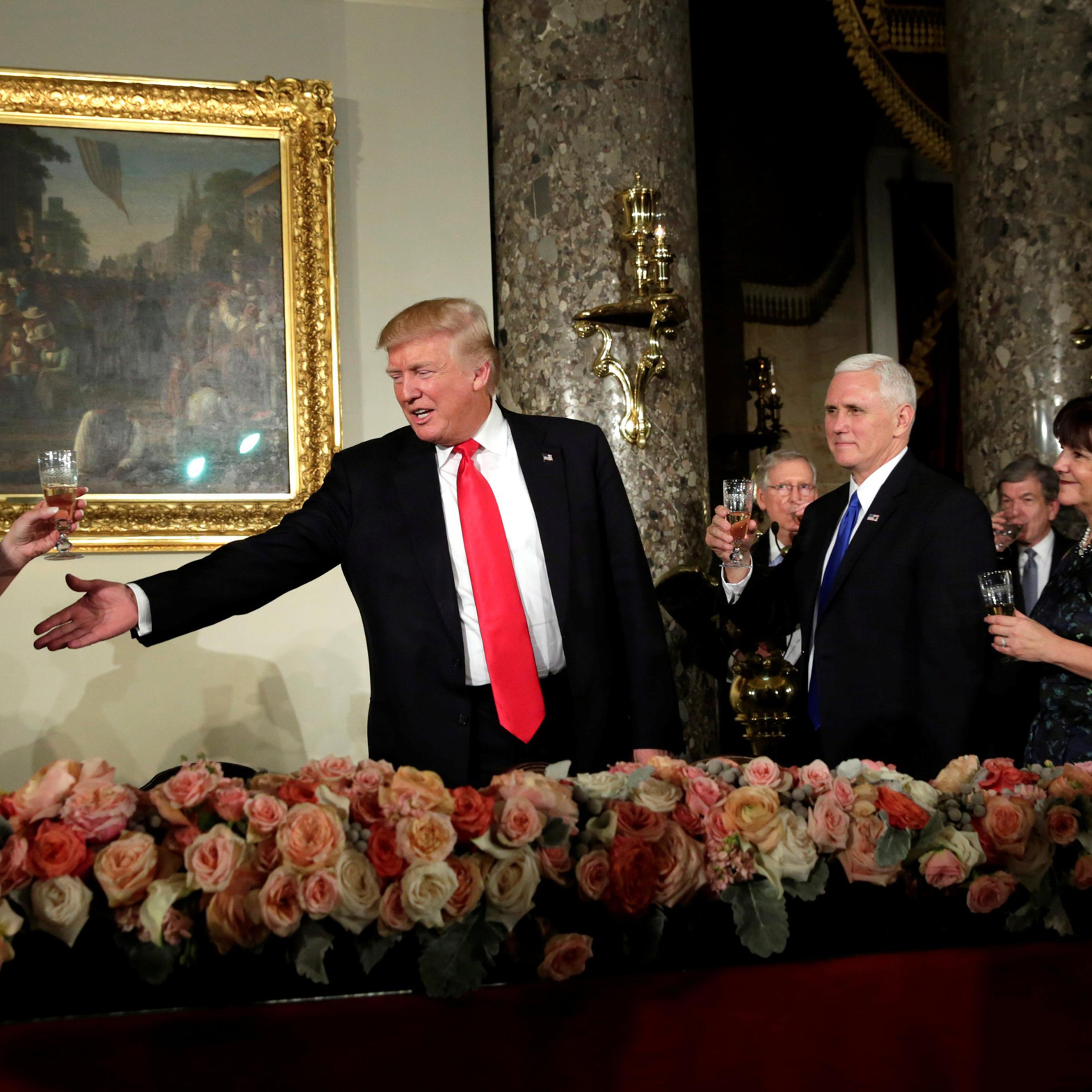 U.S. President Donald Trump gestures during a toast at the Inaugural luncheon at the National Statuary Hall in Washington, U.S, January 20, 2017. REUTERS/Yuri Gripas