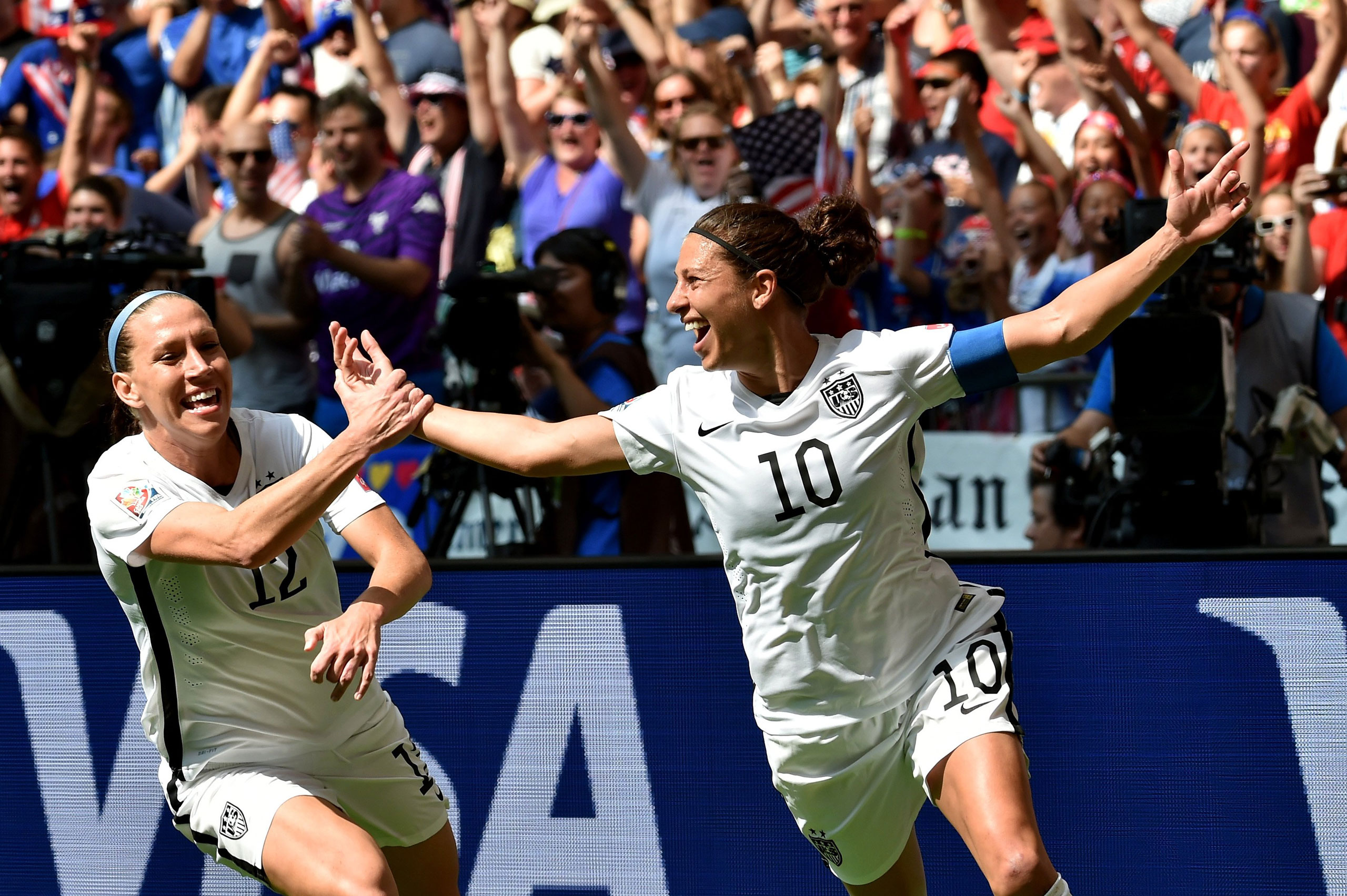Lauren Holiday #12 and Carli Lloyd #10 of the United States celebrate with teammates after Lloyd scores her second goal against Japan in the FIFA Women's World Cup Canada 2015 Final at BC Place Stadium on July 5, 2015 in Vancouver, Canada. (Photo by Rich