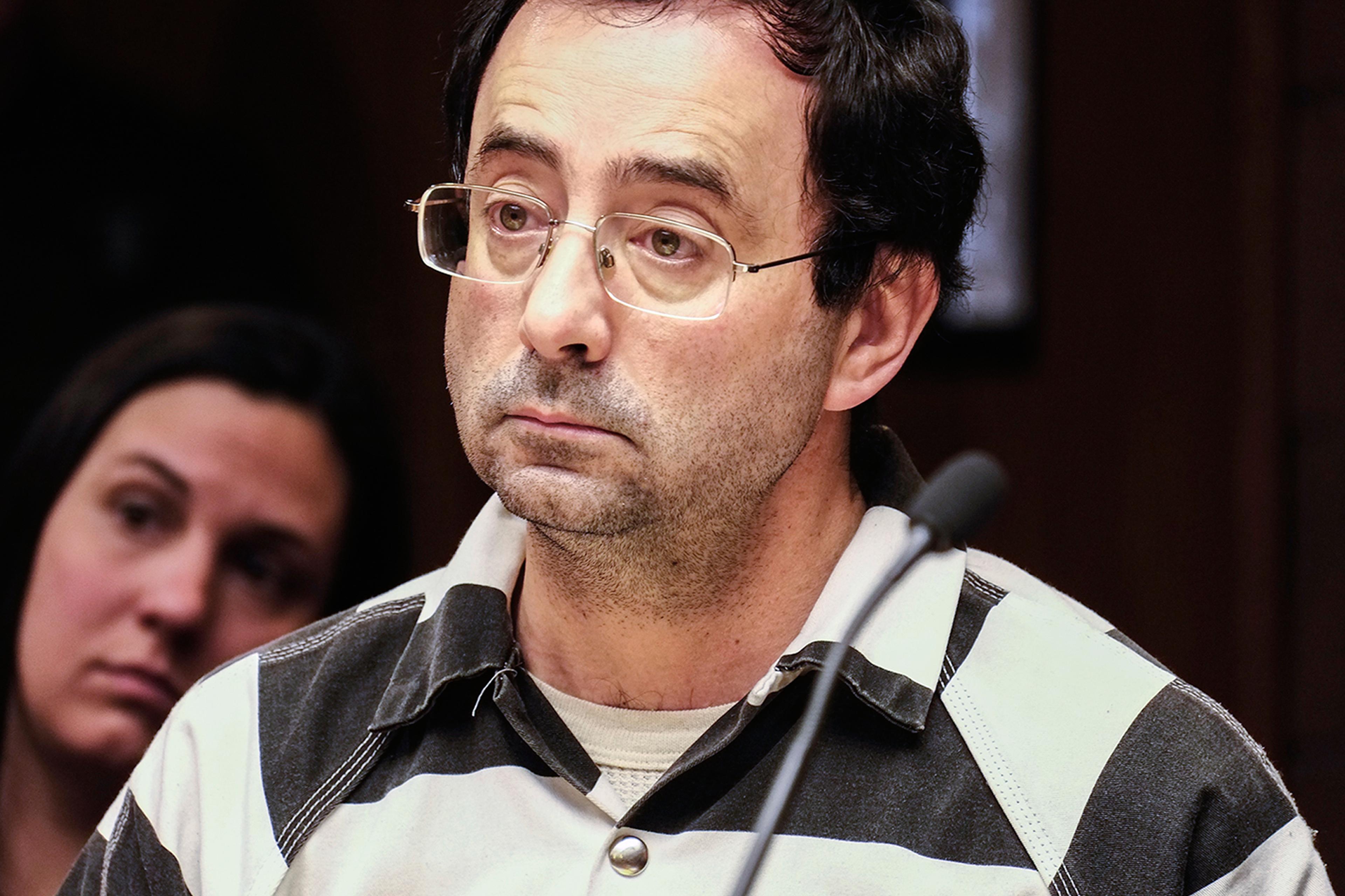 Dr. Larry Nassar listens to testimony of a witness during a preliminary hearing Friday, Feb. 17, 2017, in Lansing, Mich. A judge on Friday ordered Nassar, a former Michigan State University and USA Gymnastics sports doctor, to stand trial on sexual assau