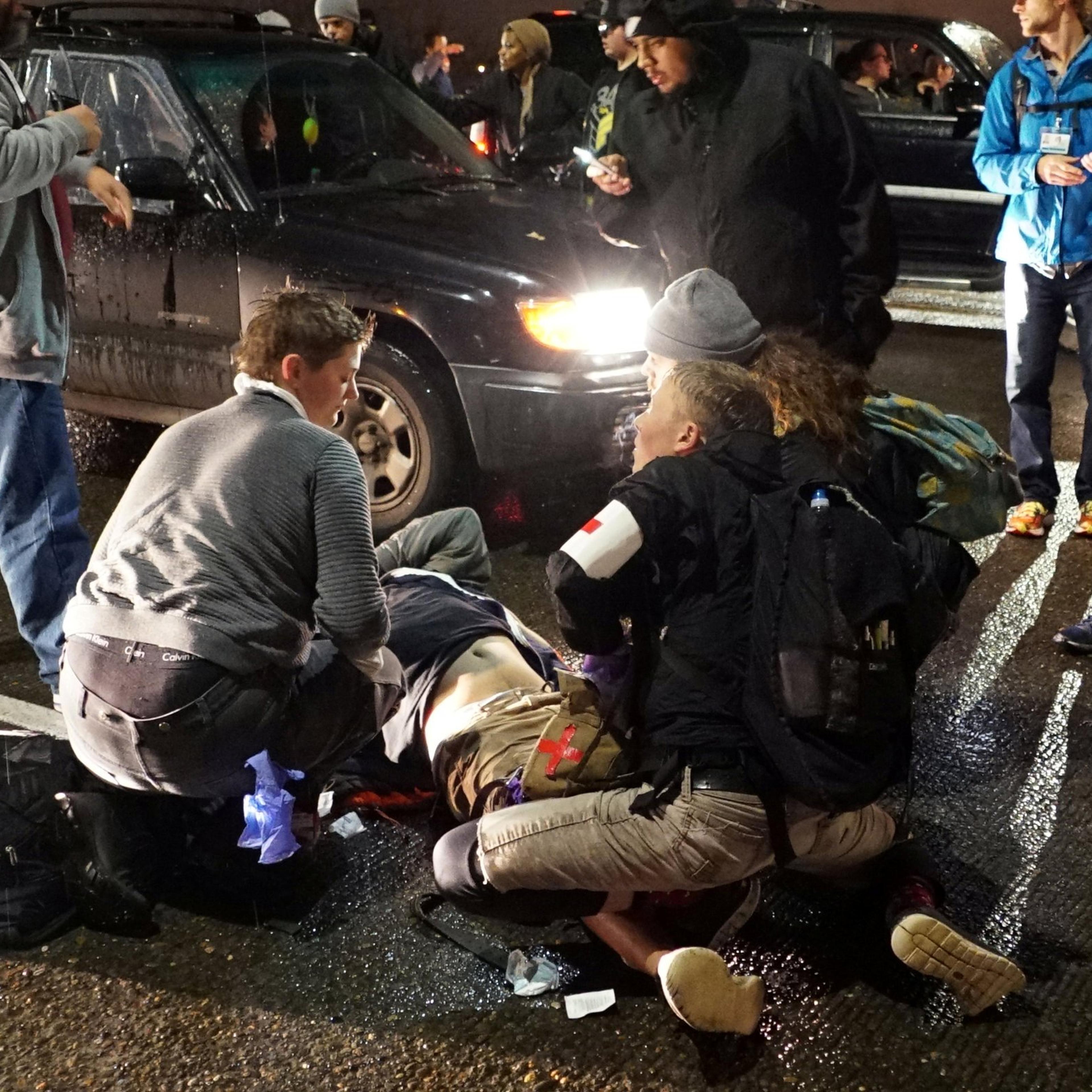A demonstrator is treated for a gunshot wound during a protest against the election of Republican Donald Trump as President of the United States in Portland, Oregon