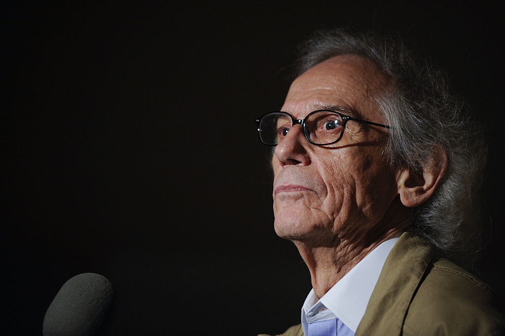 Artist Christo speaks at a press conference unveiling two original preparatory collages for 'Over The River' on Nov. 8, 2011 in Washington, DC.