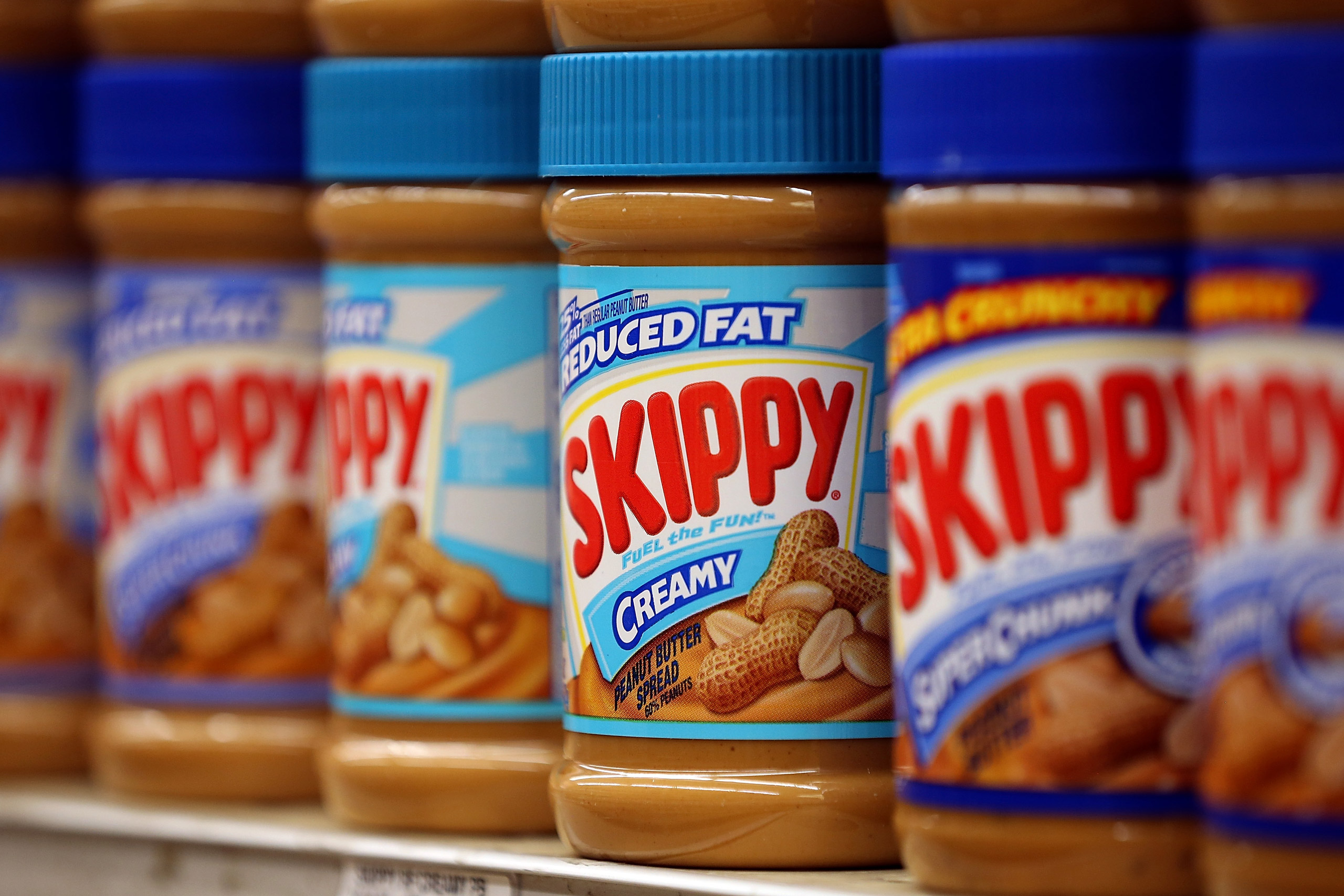 SAN FRANCISCO, CA - JANUARY 03: Jars of Skippy peanut butter are displayed on a shelf at Cal Mart grocery store on January 3, 2013 in San Francisco, California. Hormel, the maker of Spam, announced that it will purchase the Skippy peanut butter brand fro