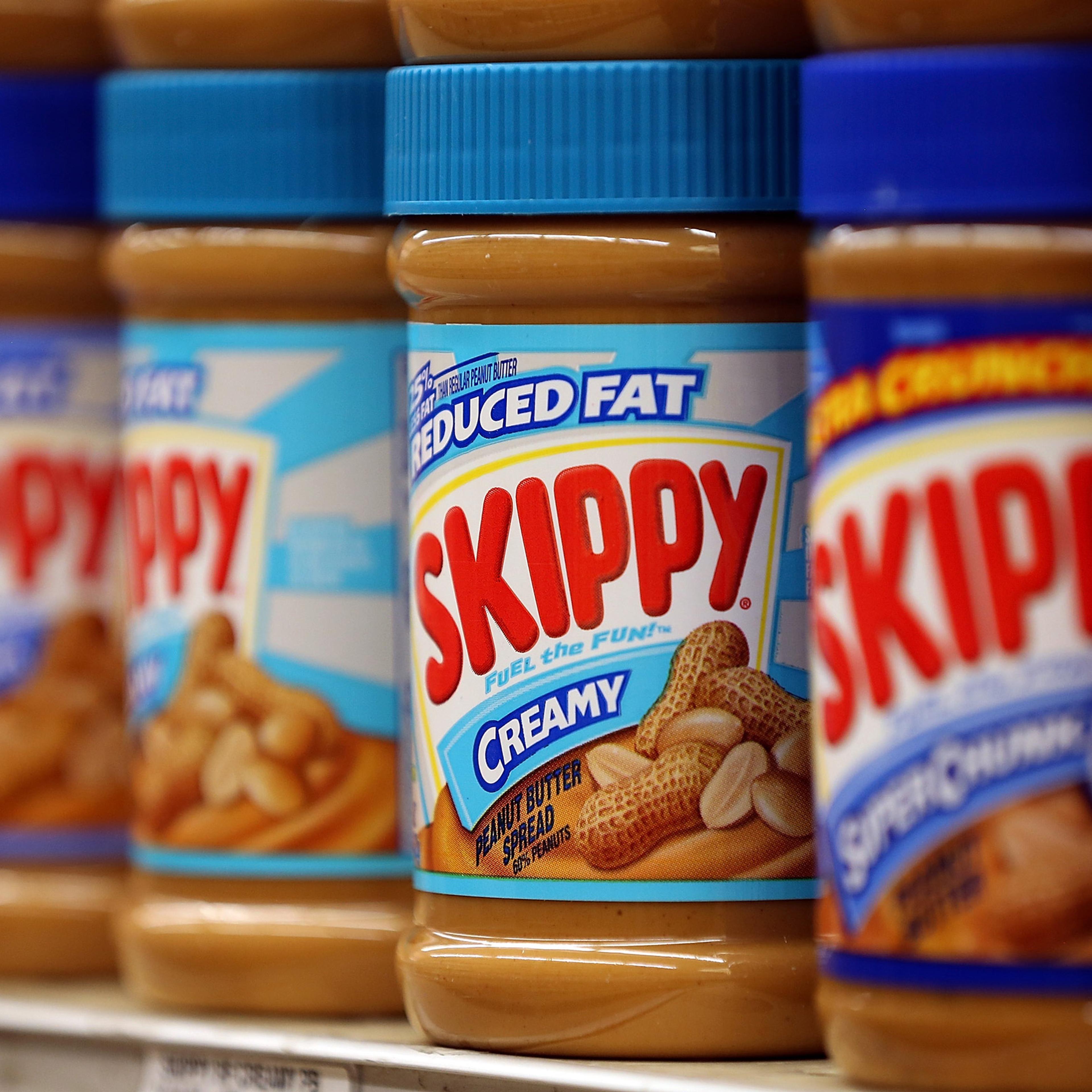 SAN FRANCISCO, CA - JANUARY 03: Jars of Skippy peanut butter are displayed on a shelf at Cal Mart grocery store on January 3, 2013 in San Francisco, California. Hormel, the maker of Spam, announced that it will purchase the Skippy peanut butter brand fro