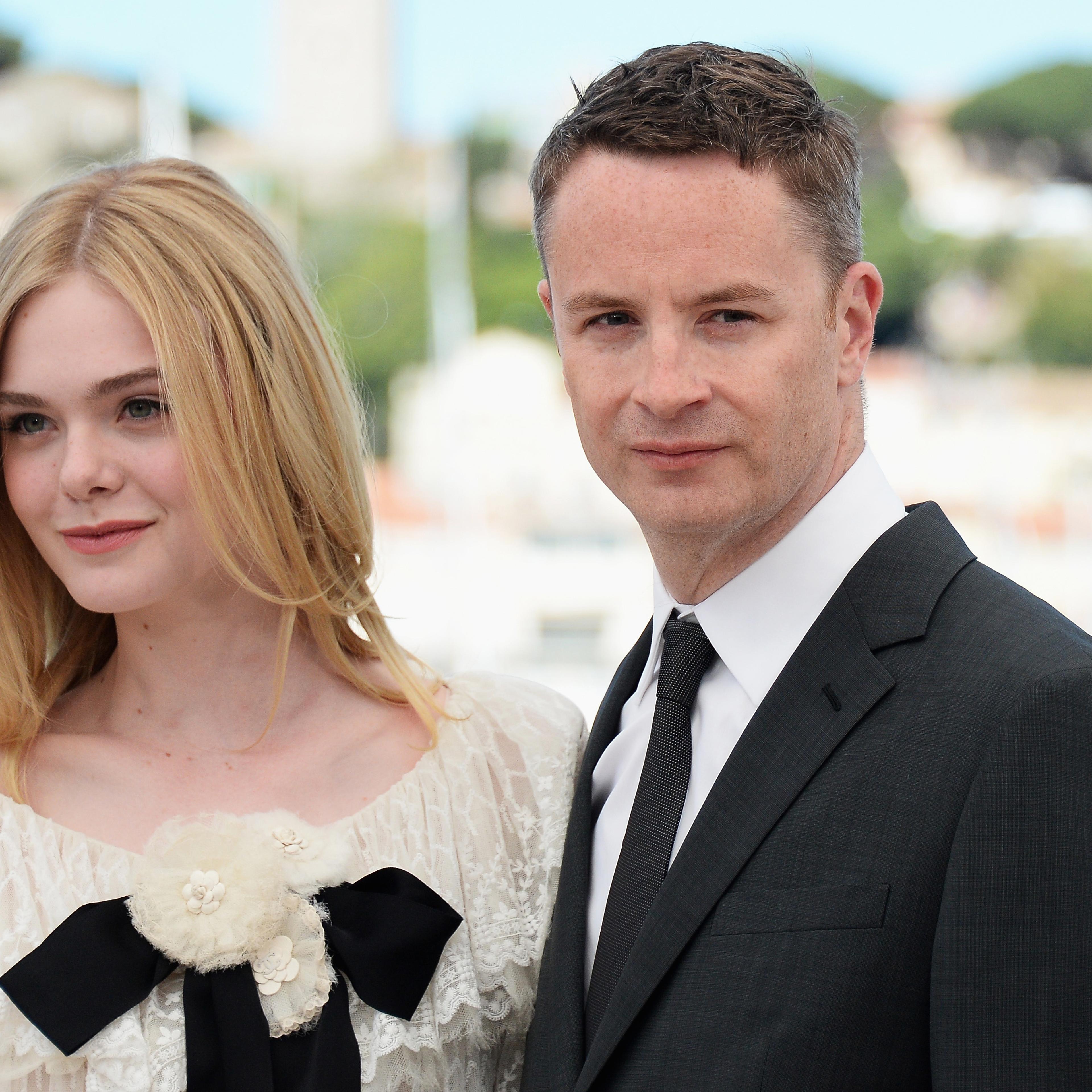 Elle Fanning and director Nicolas Winding Refn during the 69th annual Cannes Film Festival at the Palais des Festivals on May 20, 2016 in Cannes, France.